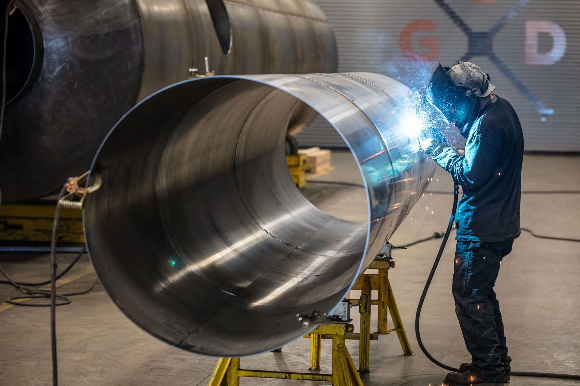 Welder working and welding at EMIT Technologies in Sheridan, Wyoming.