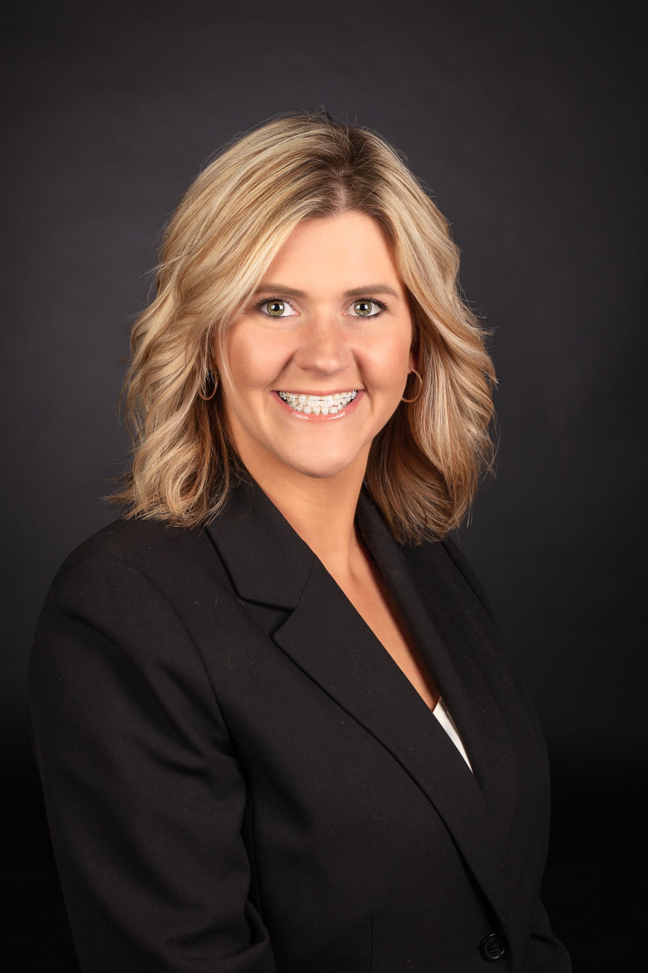 Black seamless background for business and corporate headshot portraits.