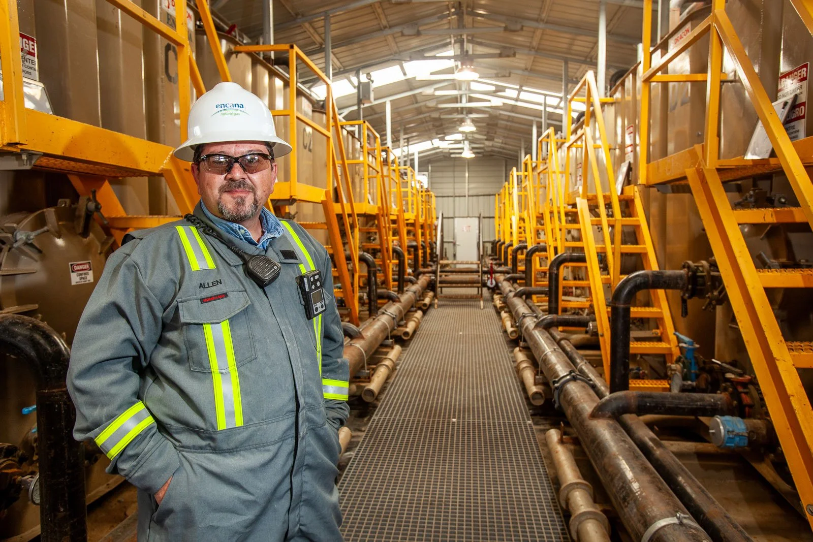 Industrial portrait at a oil and gas field water treatment facilty.