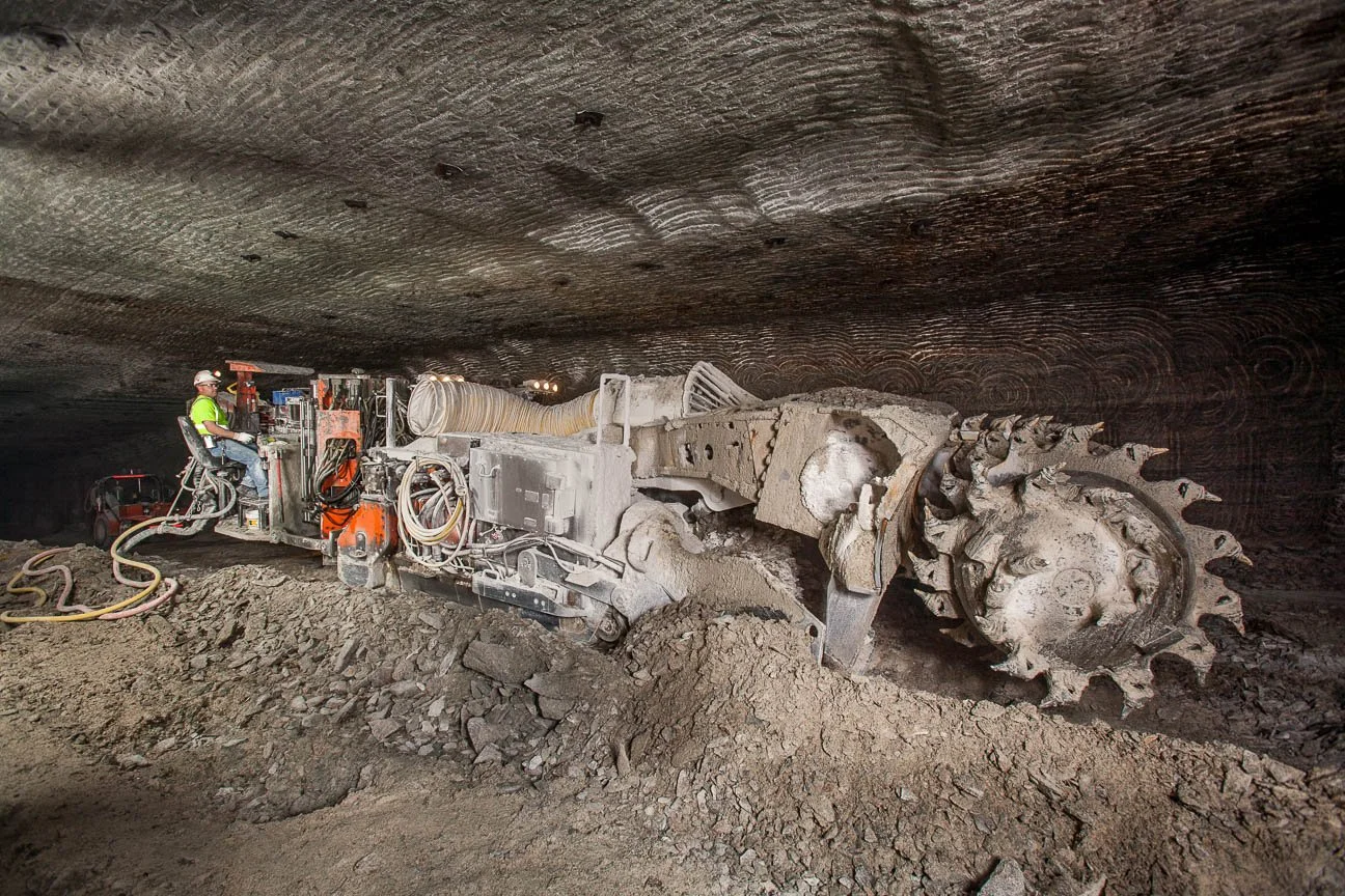 Industrial and mining photography including a miner in a trona mine in southwestern Wyoming.