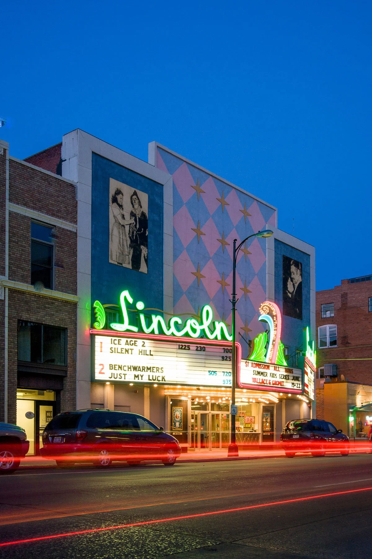 The Lincoln Theater in downtown Cheyenne, Wyoming, with traffic lights zooming by.