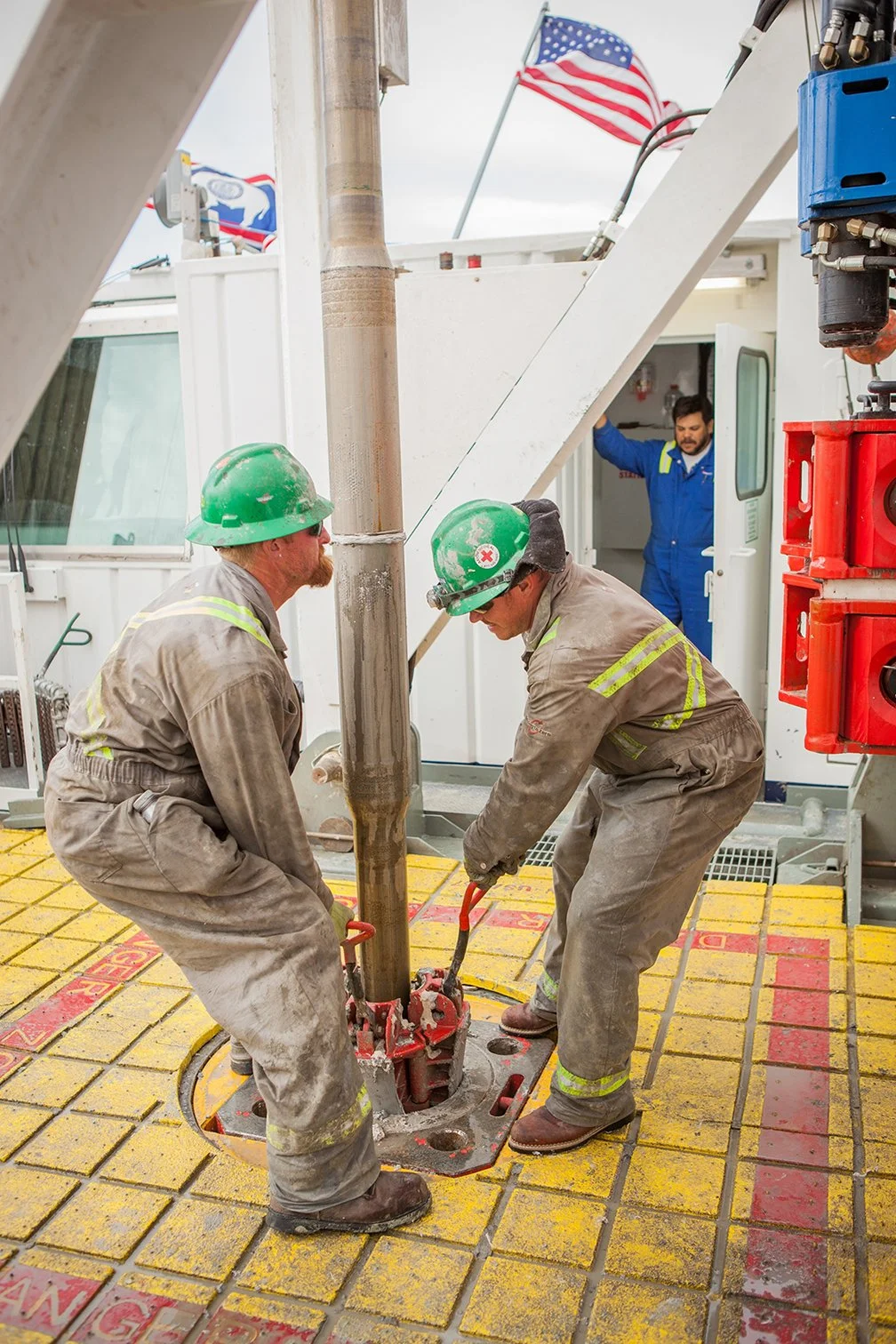 Oil rig workers on a rig in Central Colorado.