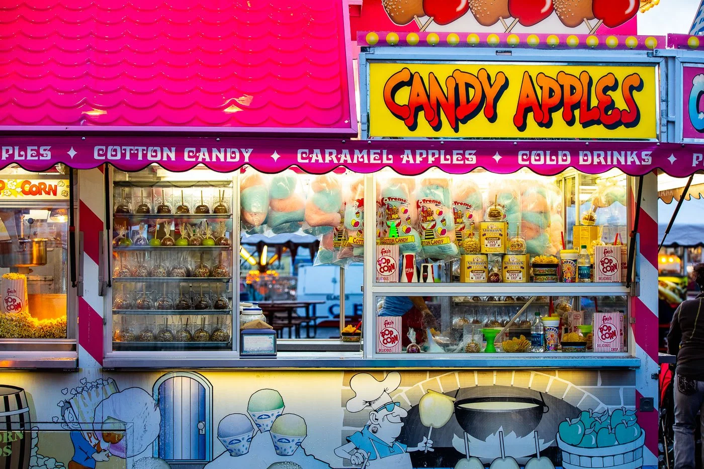 Carnival food, candy apples, cotton candy, and a food truck at the Cheyenne Frontier Days Midway and Carnival in Cheyenne, Wyoming.