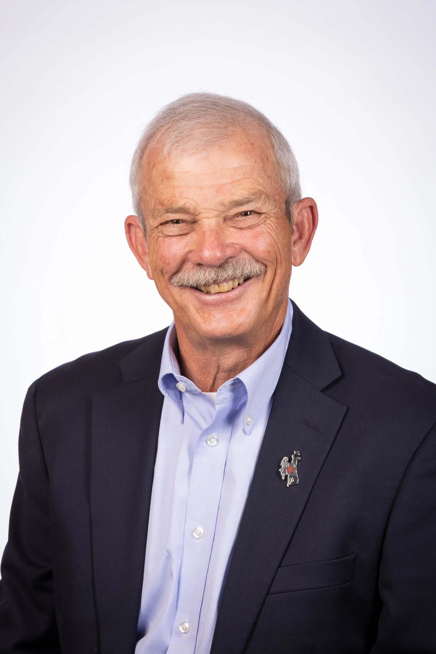 Headshot business portrait against a white background in Casper, Wyoming.