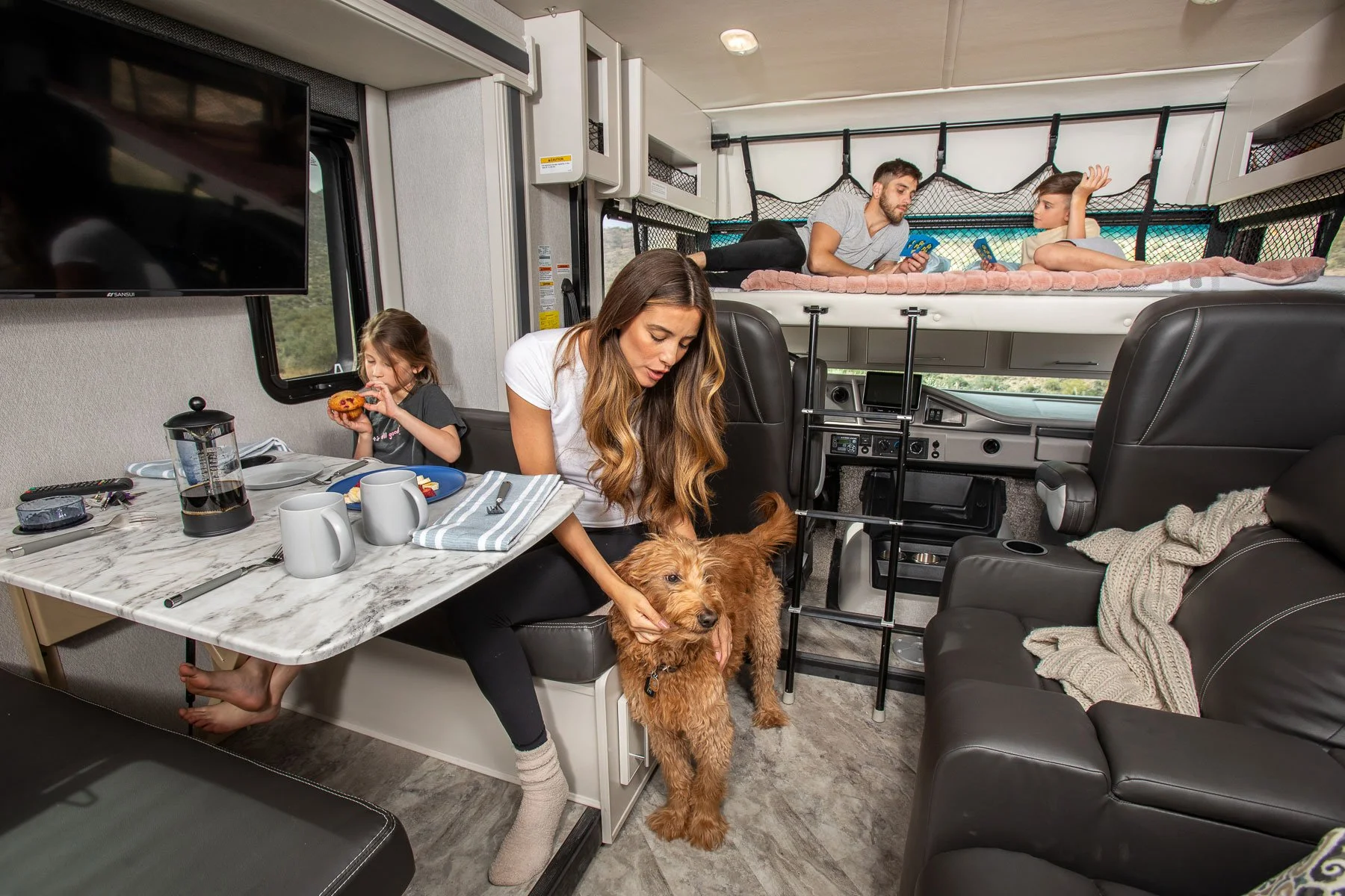 Breakfast time during a camping trip in the 2023 Holiday Rambler Eclipse at Canyon Lake in Tonto National Forest in Arizona. Image created for Rev Group.
