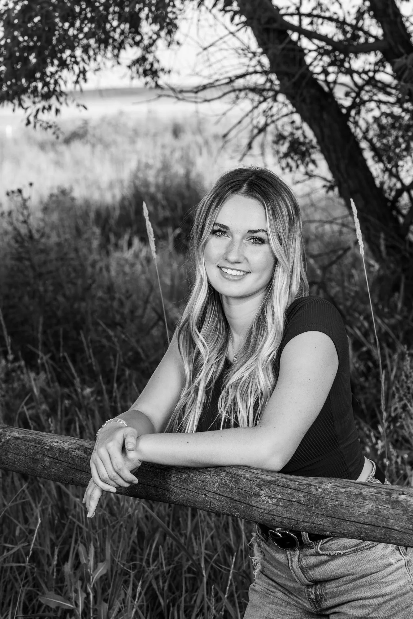 Black and white senior portrait at the Wyoming Hereford Ranch in Cheyenne, Wyoming.