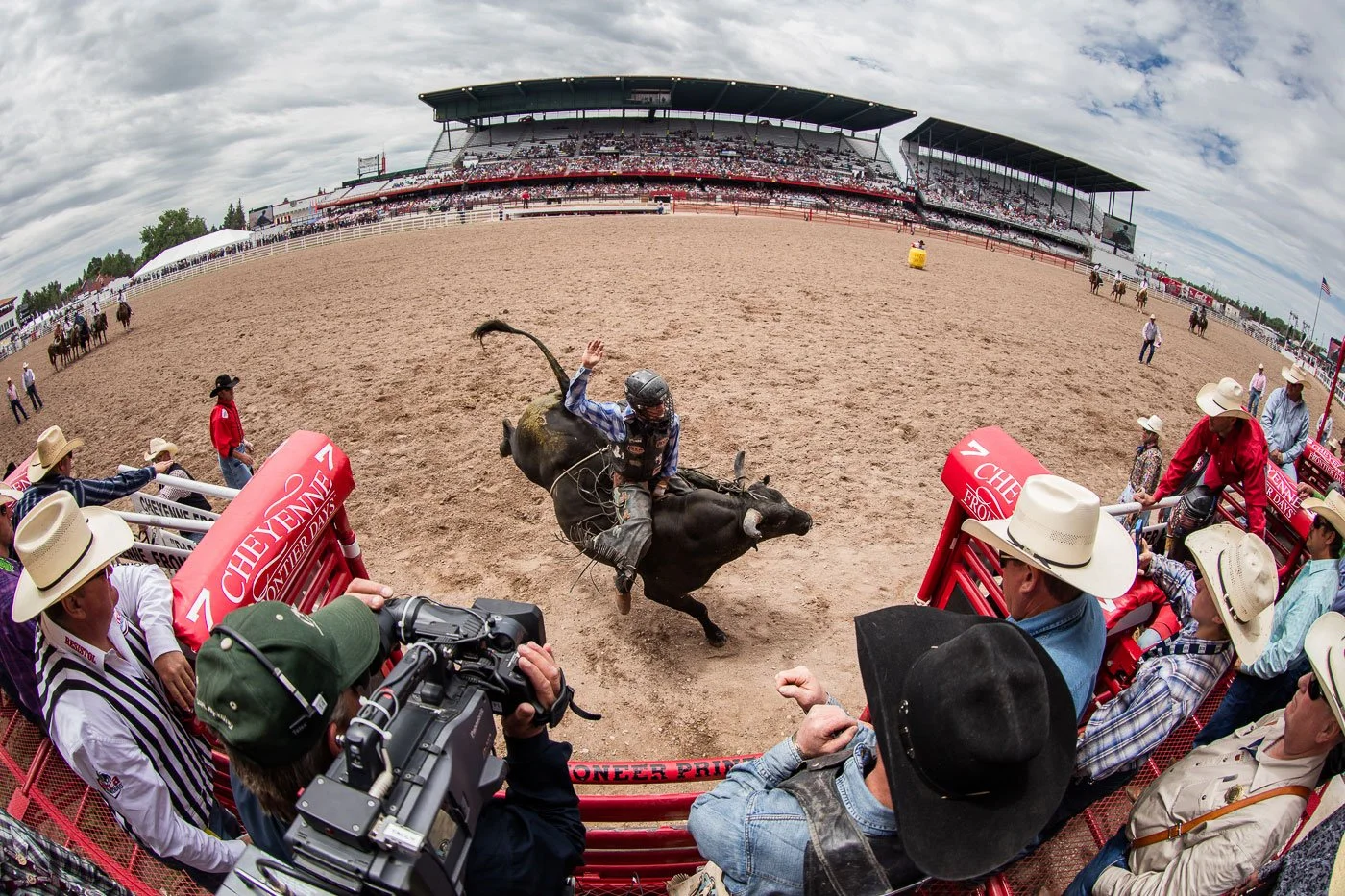 Bull Riding action from behind the chutes at Cheyenne Frontier Days in Cheyenne, Wyoming.