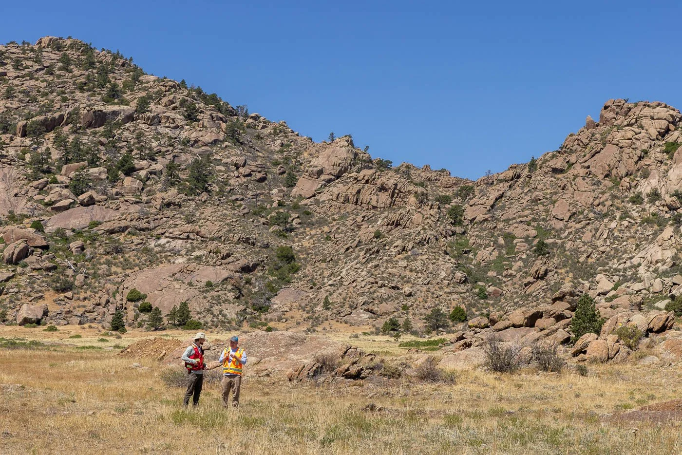 Geologists look for mineral deposits in rocks at a Rare Earth Elements mine in Wyoming.