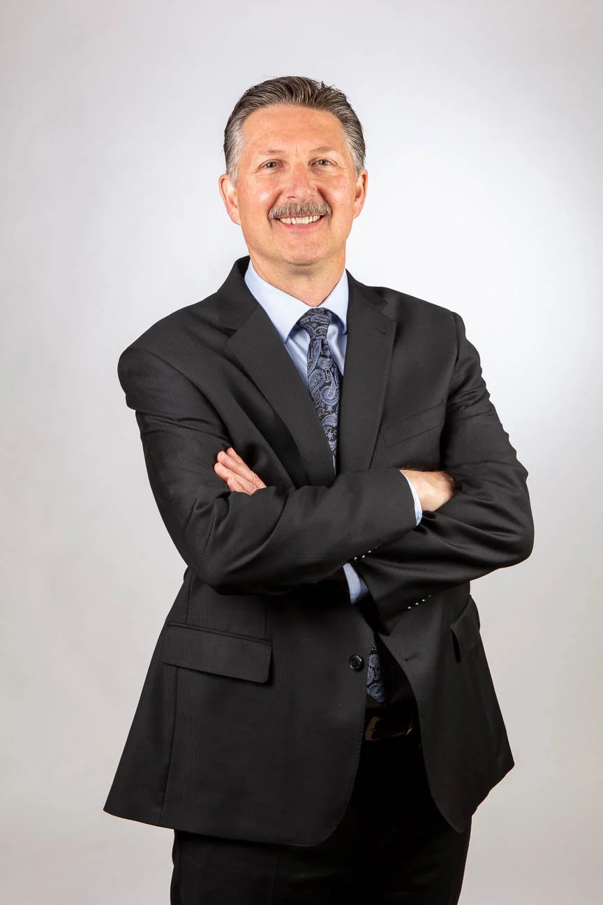Portrait for corporate use, studio setup at the client's office for convenience. Portrait image used for marketing and branding.