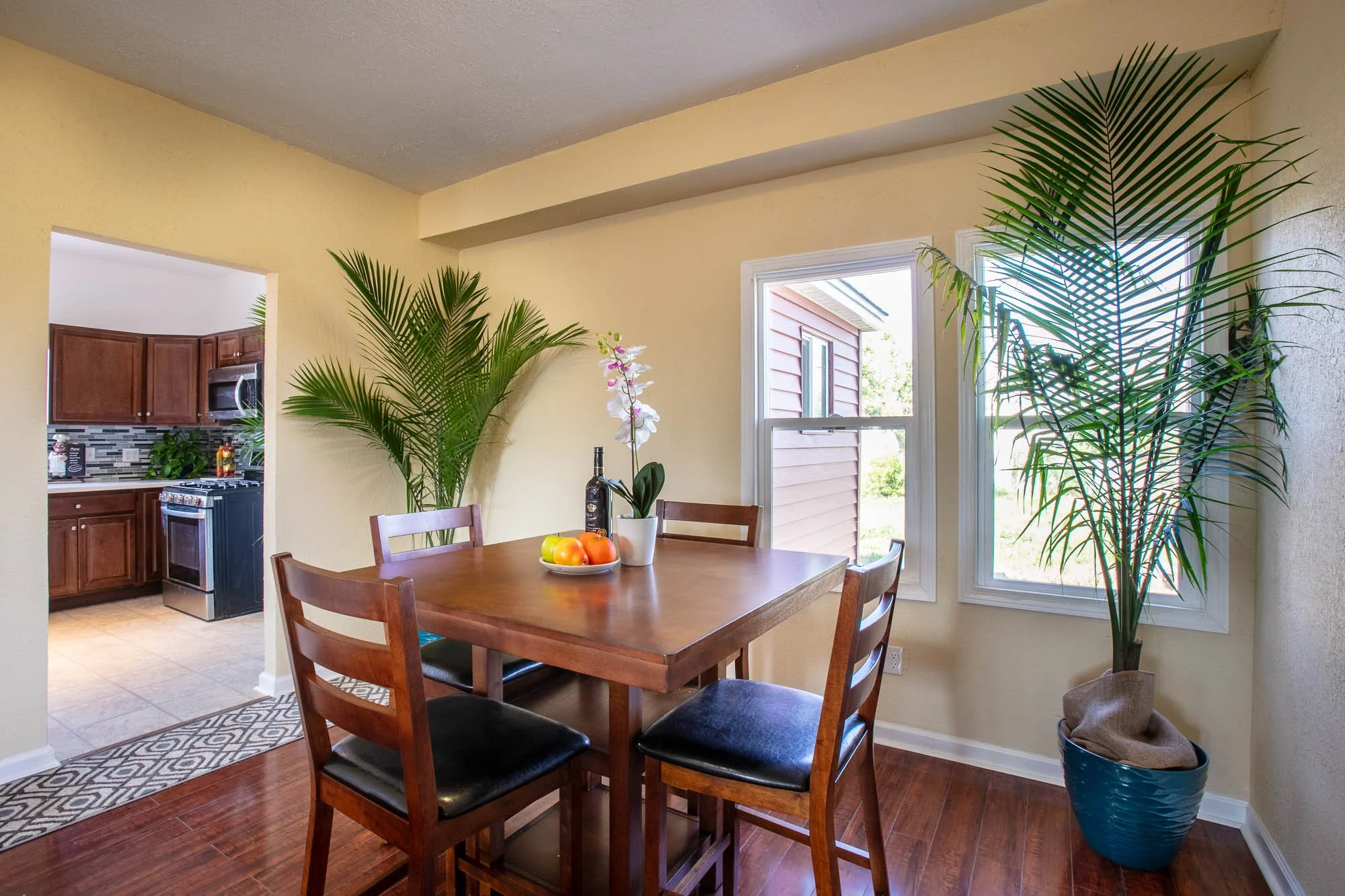 Real estate photography, including a dining room and kitchen in Pine Bluffs, Wyoming.