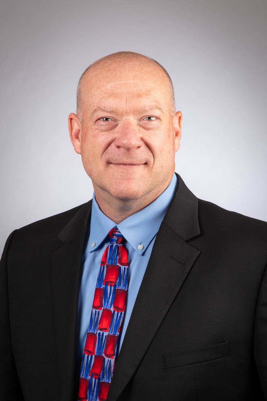 Headshot portrait for corporate marketing and branding use.