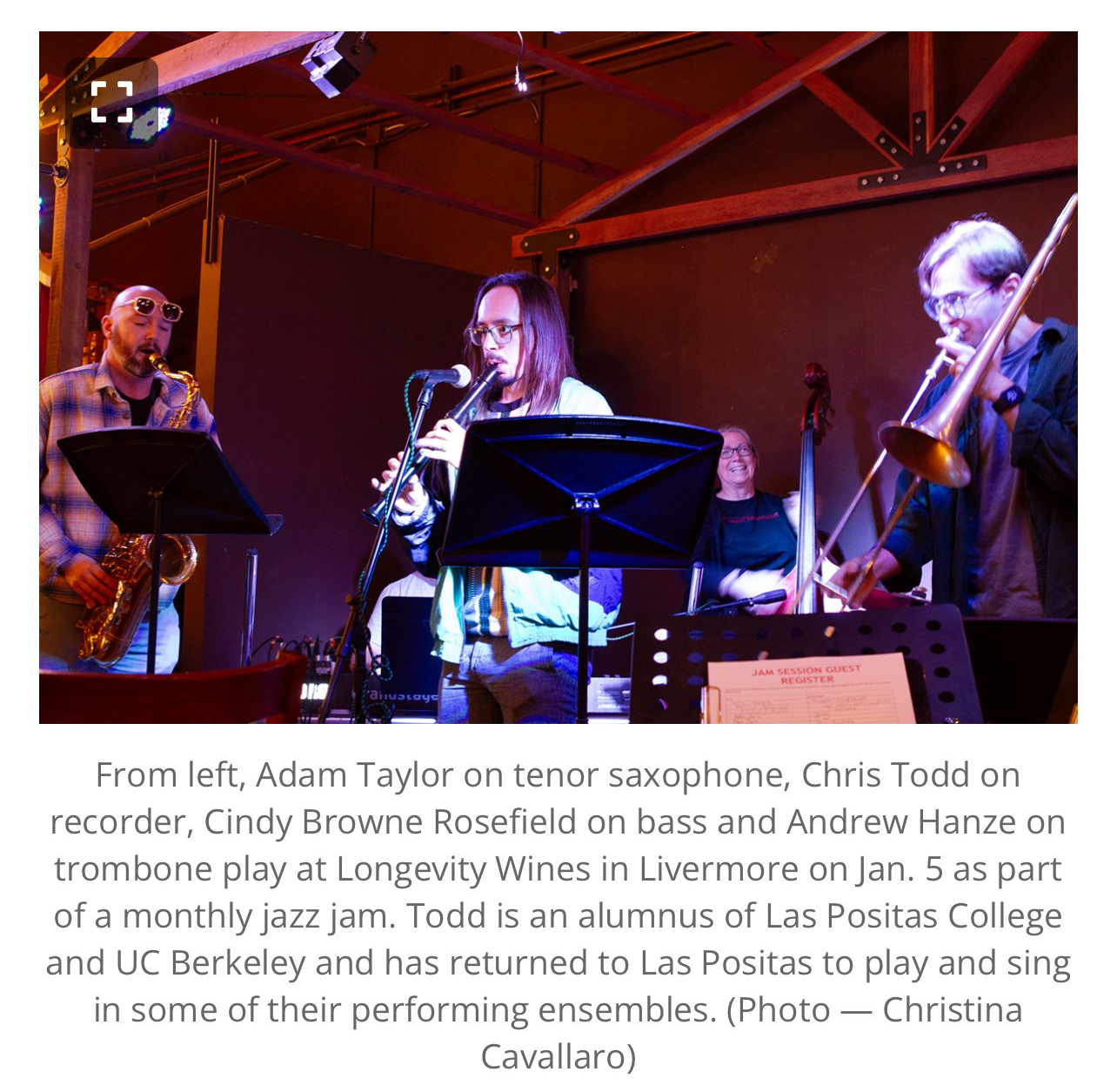 A group of jazz musicians performing on stage. From left to right, Adam Taylor on tenor saxophone, Chris Todd on recorder, Cindy Browne Rosefield on bass, and Andrew Hanze on trombone. The stage features wooden beams and music stands, with a dark bac