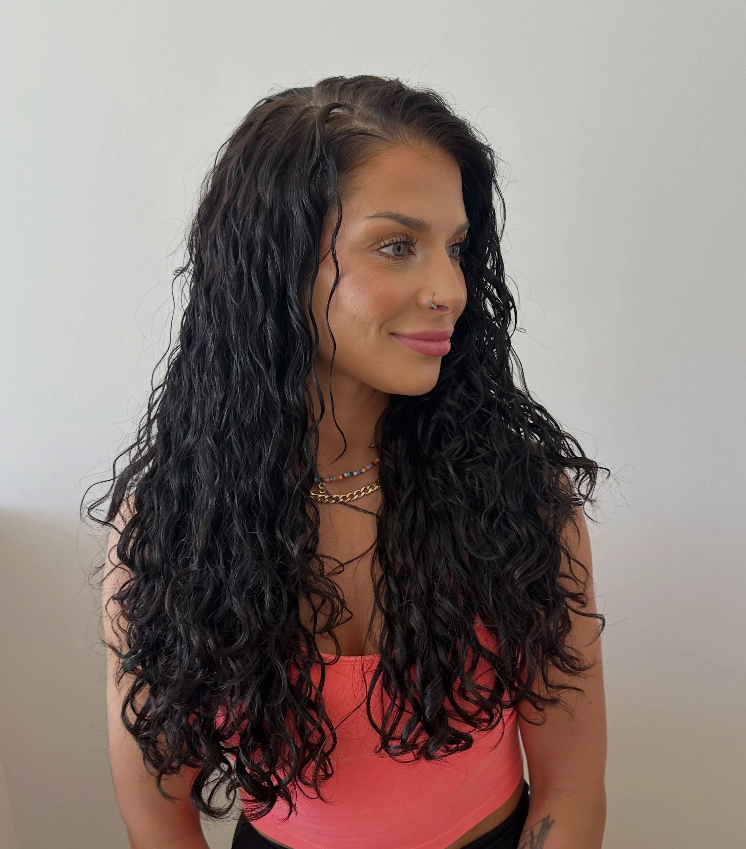 This transformation turned out so dreamy ✨
We used a more traditional perm solution to create defined, long-lasting movement that would &ldquo;defy gravity&rdquo; alittle bit with her hair being so long and full, while still keeping the hair soft and