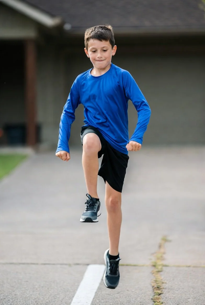 young basketball player performing movement drill for youth basketball injury prevention training
