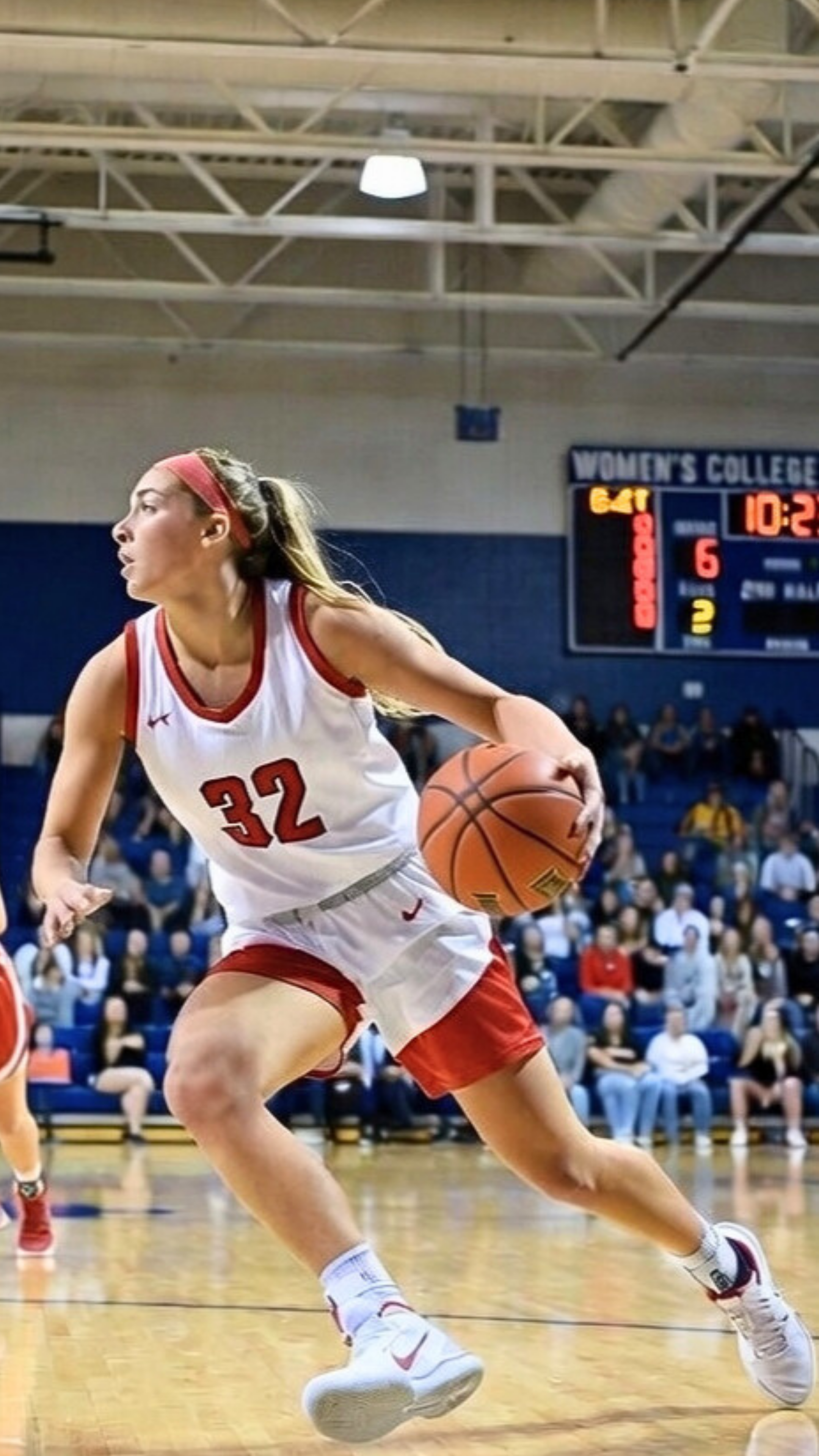 Female basketball player cutting with the ball, showing change of direction and deceleration mechanics