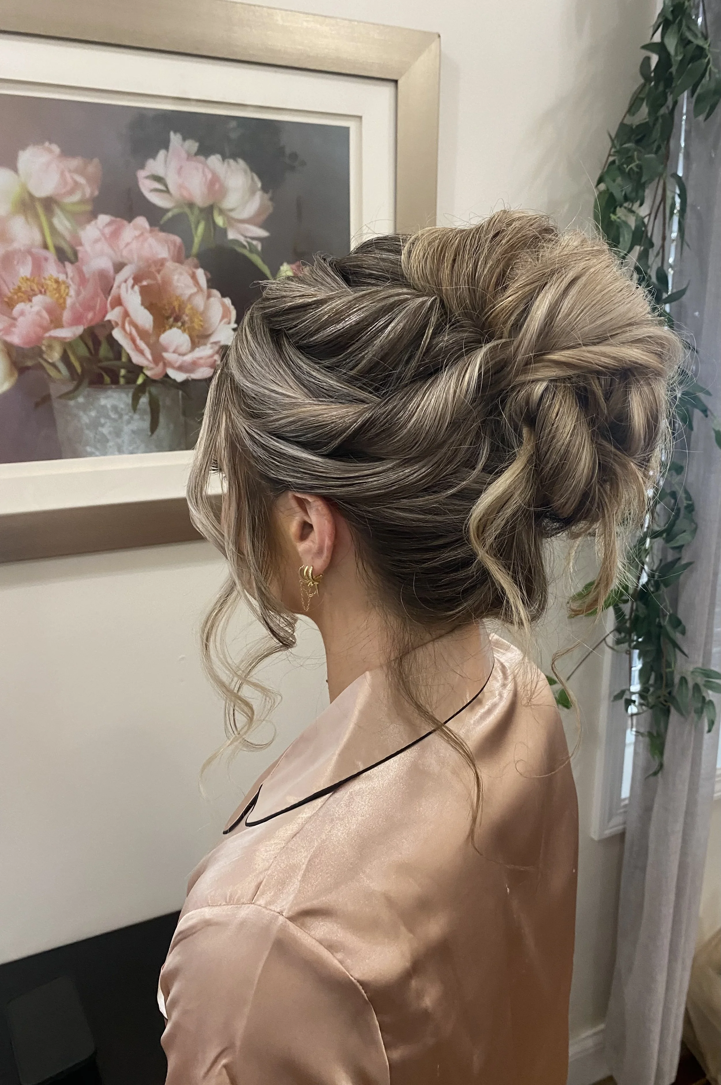 Twisted and textured high bun updo