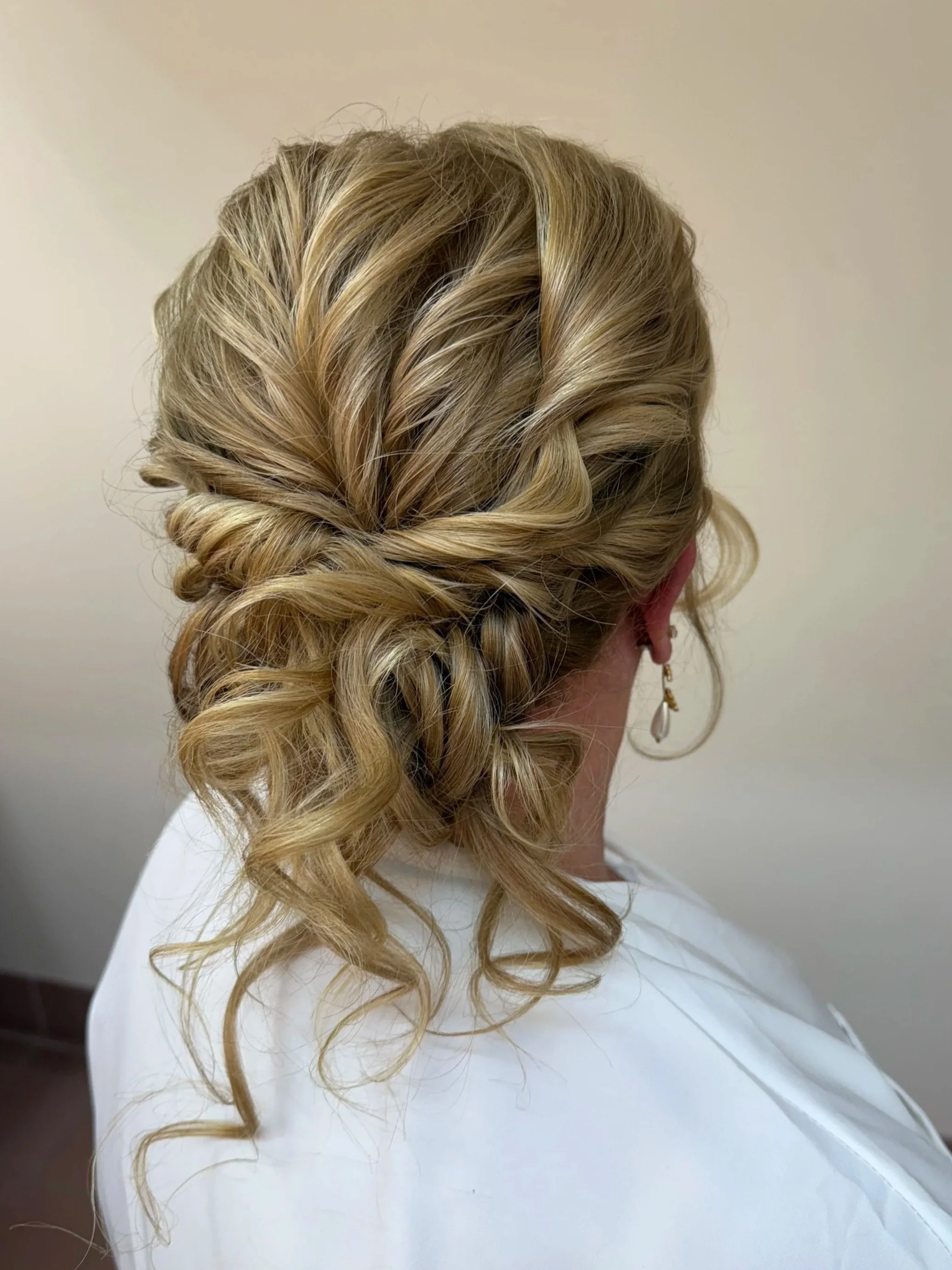 twisted and textured low bun hairstyle on a bride