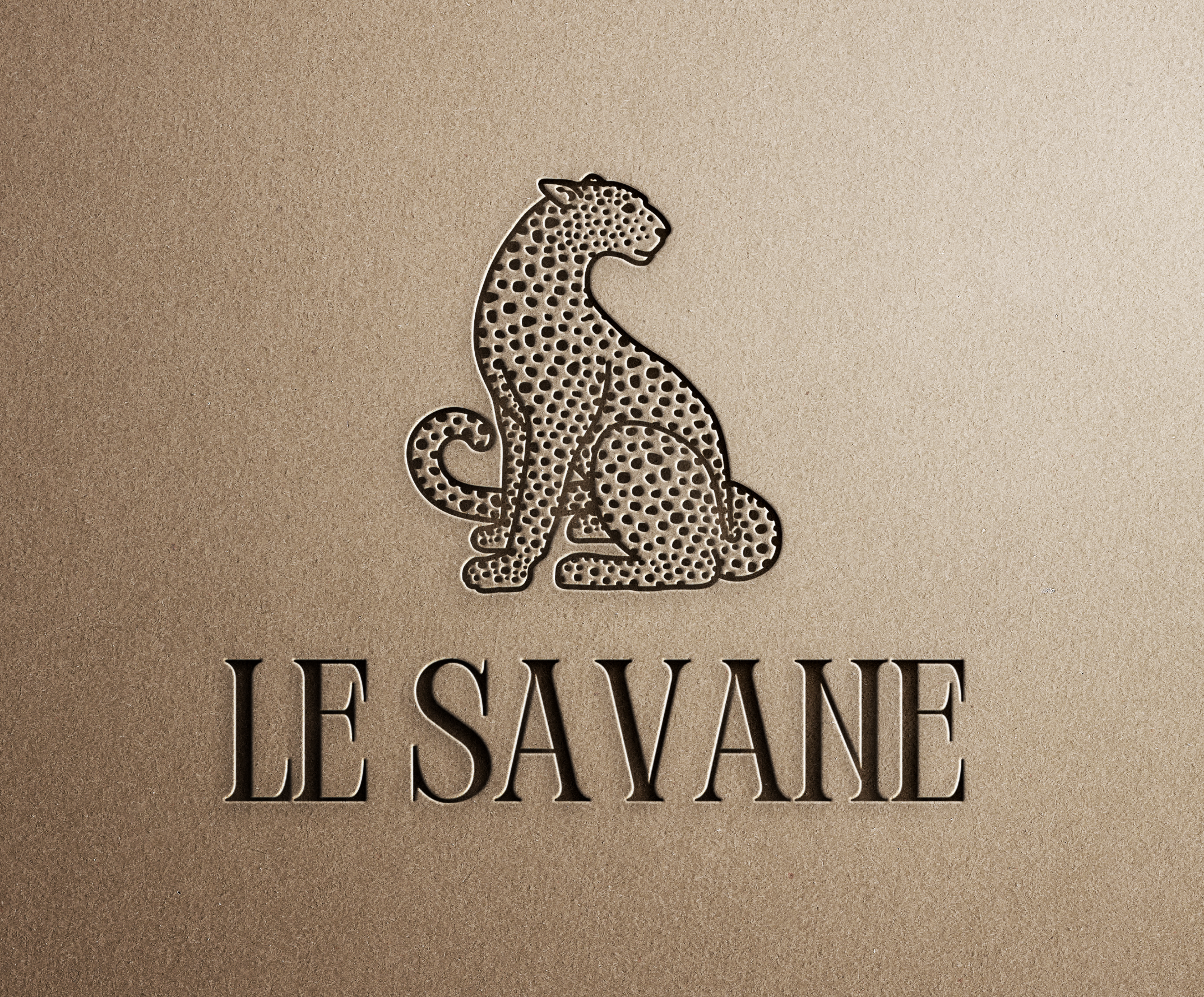 A metallic logo of a sitting leopard with a dotted pattern, accompanied by the text 'LE SAVANE' beneath it, on a beige background.