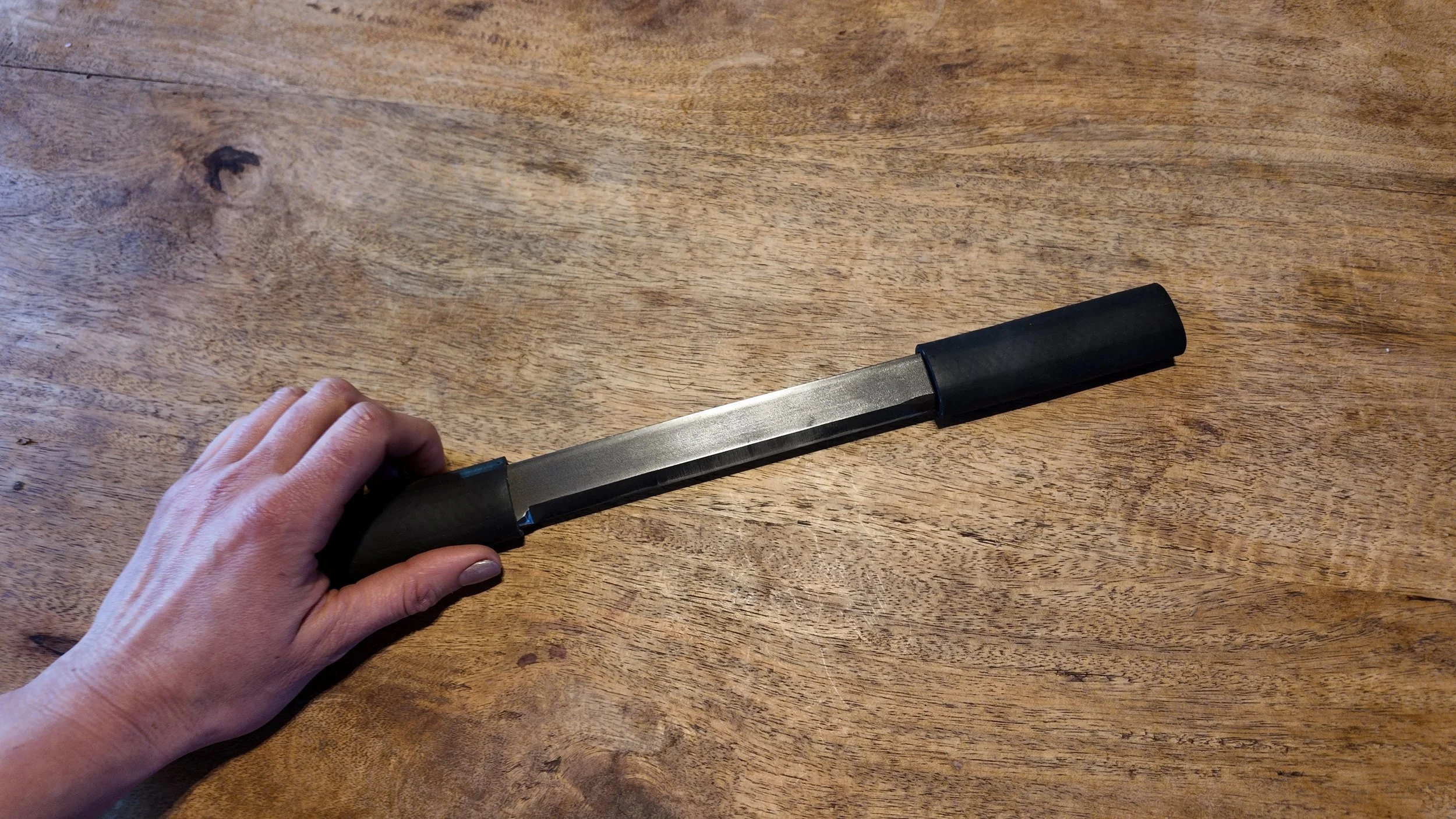 The Rune Wet-Scraper – Stainless Steel Hide Tanning Tool - In Hand.JPG