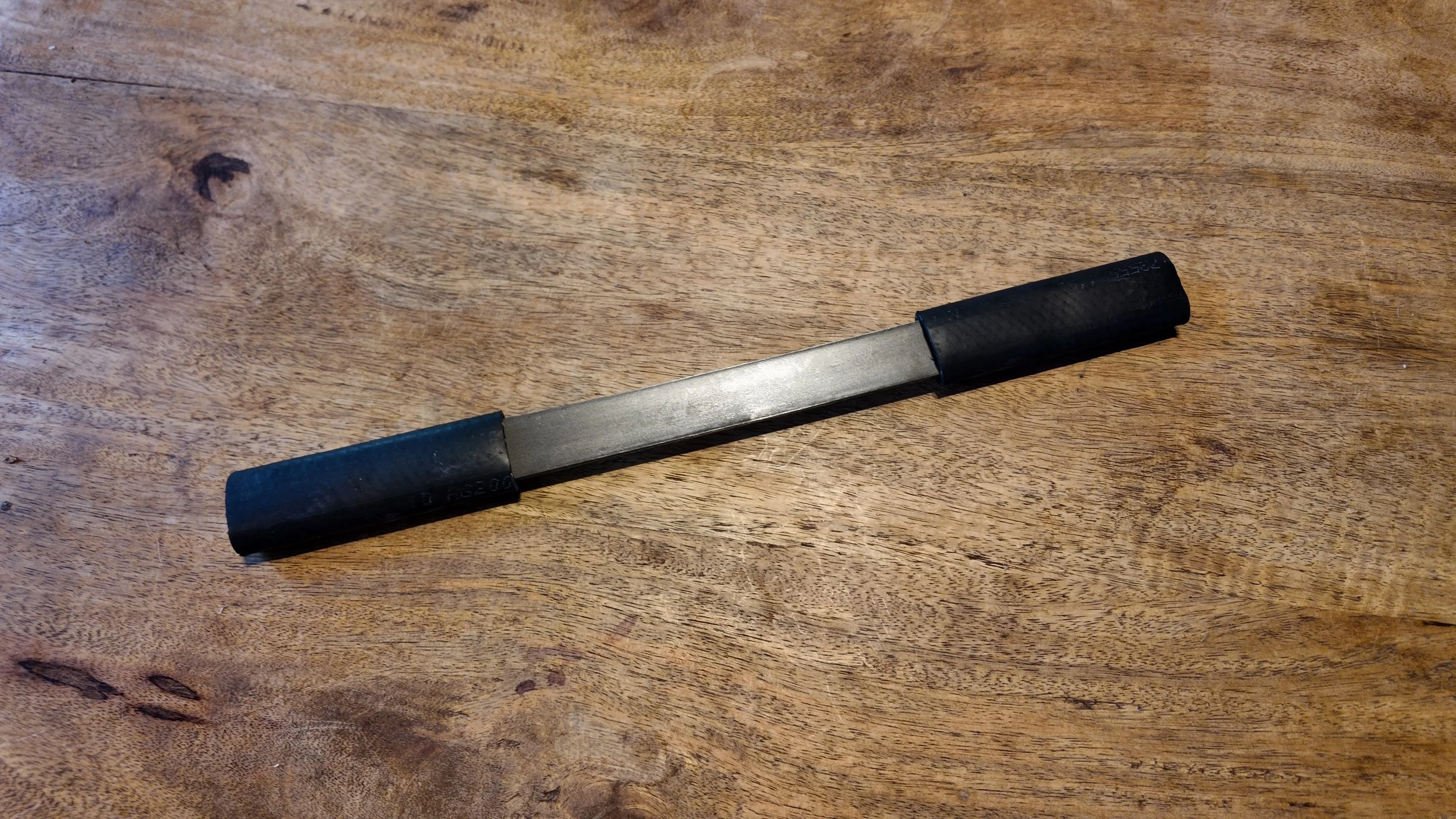 The Rune Wet-Scraper – Stainless Steel Hide Tanning Tool - Top View 2nd Side.JPG