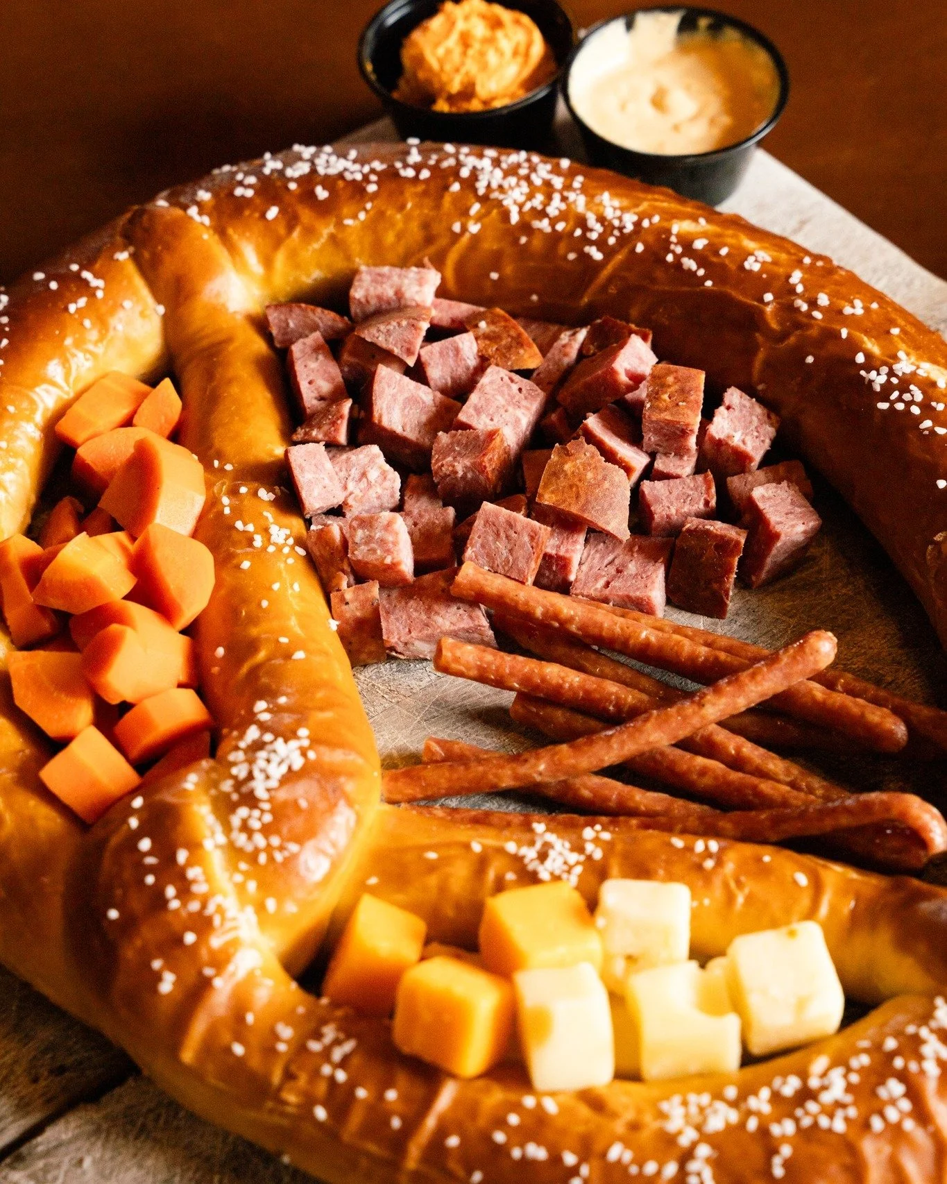 Charcuterie, but make it Bavarian 🇫🇷🤝🇩🇪

Forget dainty crackers&mdash;our pretzel-cuterie board brings the party with a giant haus-baked pretzel, assorted meats and cheeses, pickled carrots, and creamy obatzda dip 😋

Big, bold, and perfect for 