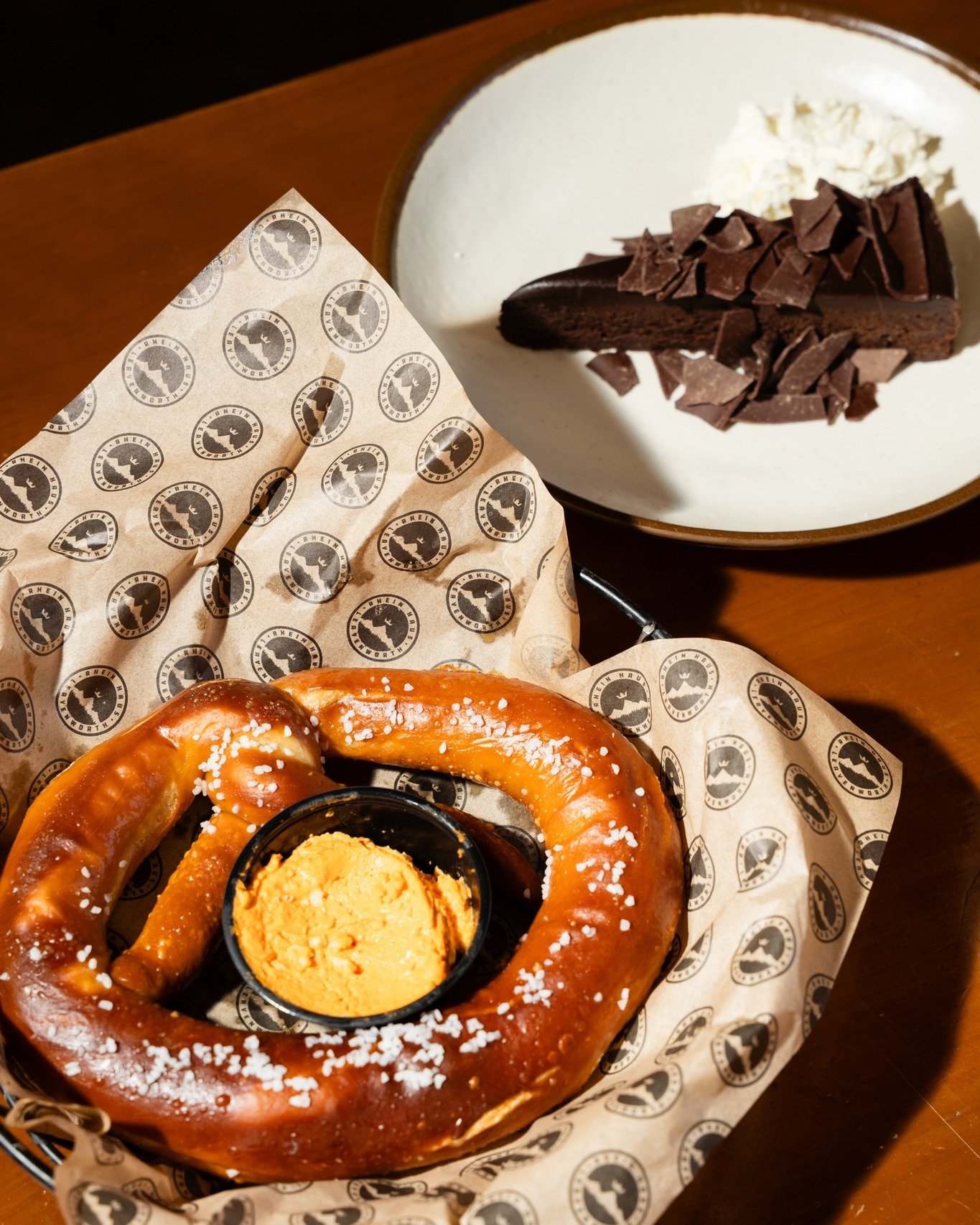 Just one of our favorite salty‑sweet treats: a warm pretzel and a slice of flourless chocolate cake. A little something for both sides of your heart ❤️🥨🍫