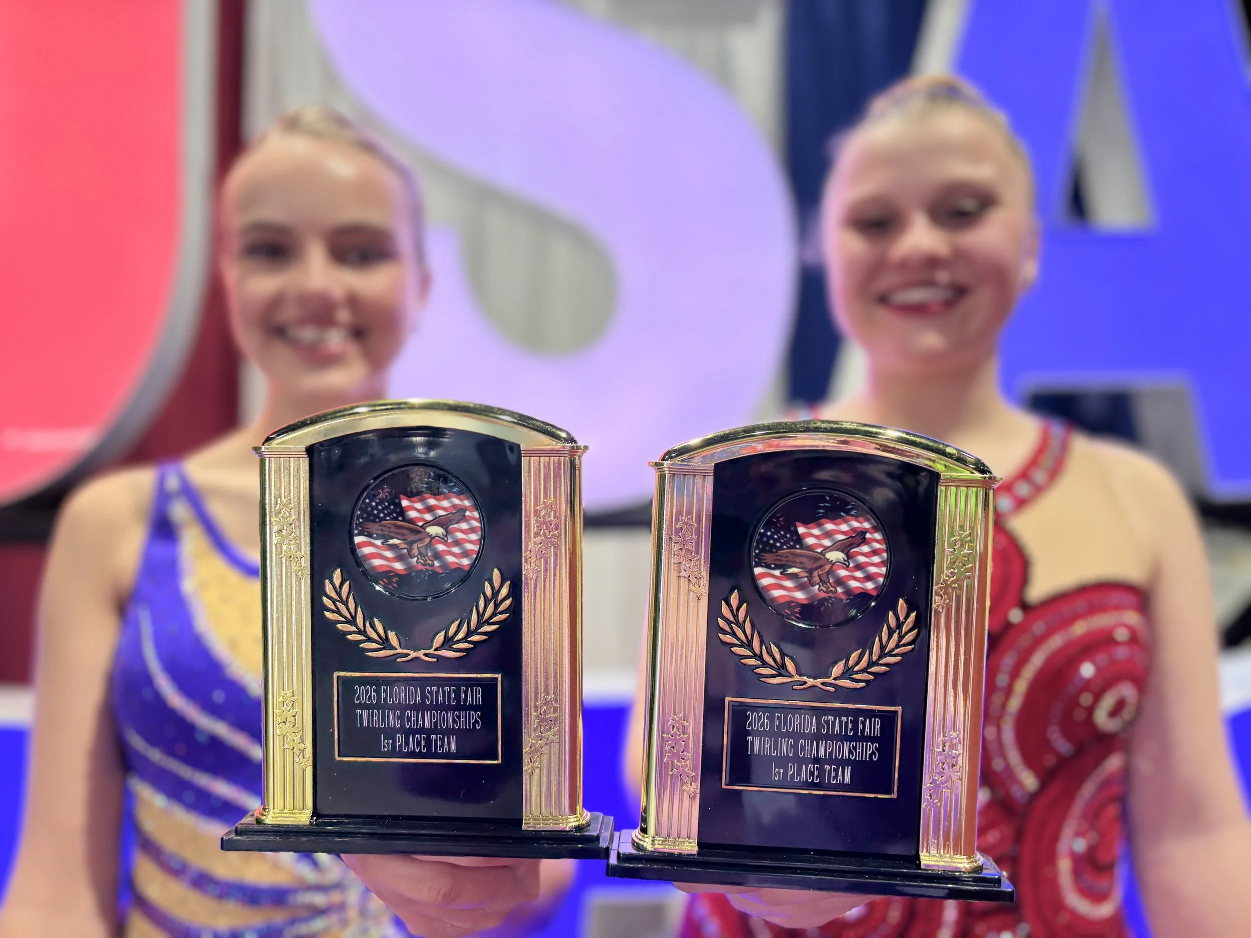 FLARE Baton Team Competitive Twirlers posing with her hard earned competition awards from the 2026 Florida State Fair Competition!