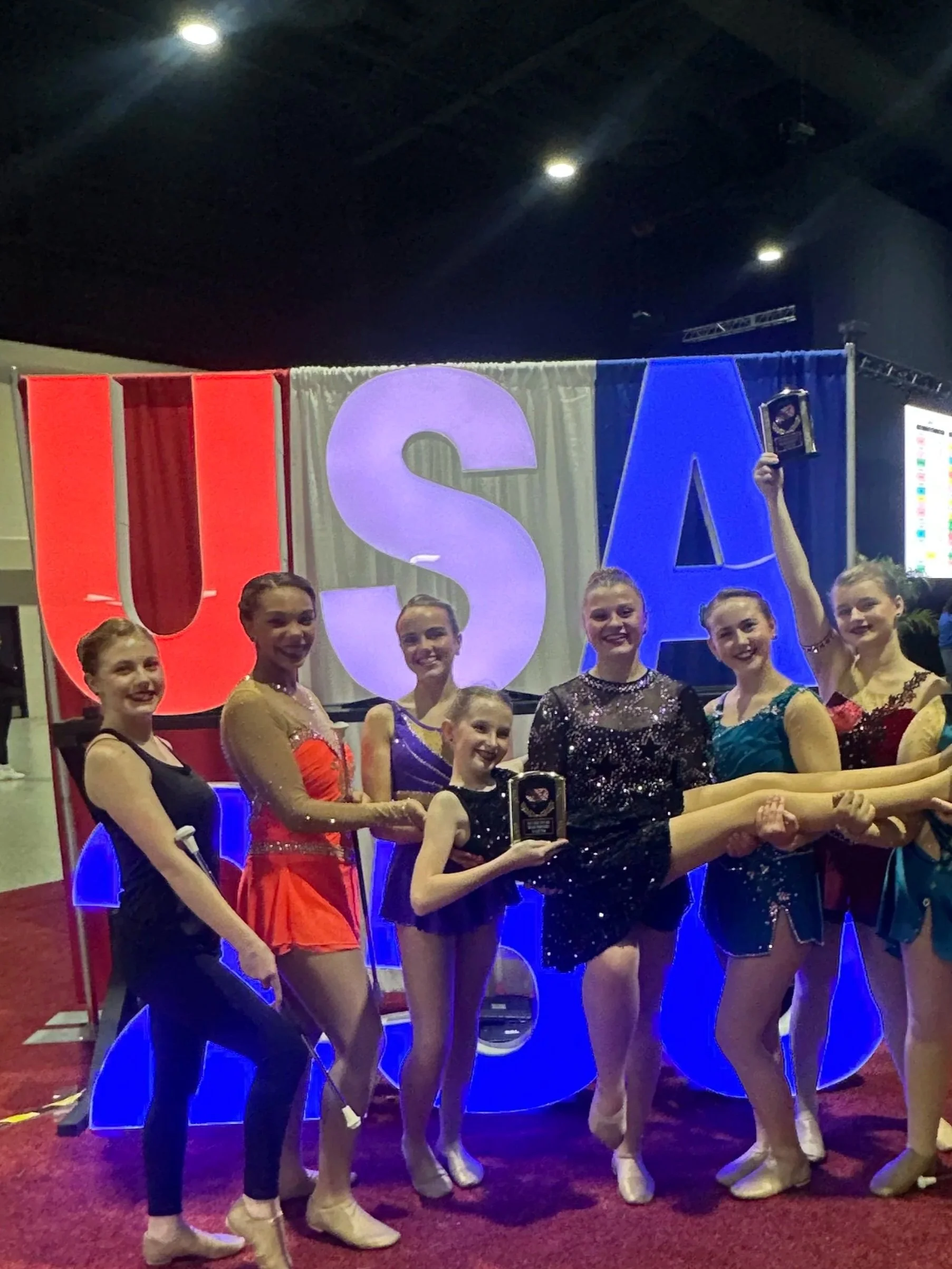 FLARE Baton Team Competitive Twirlers posing with her hard earned competition awards from the 2026 Florida State Fair Competition!