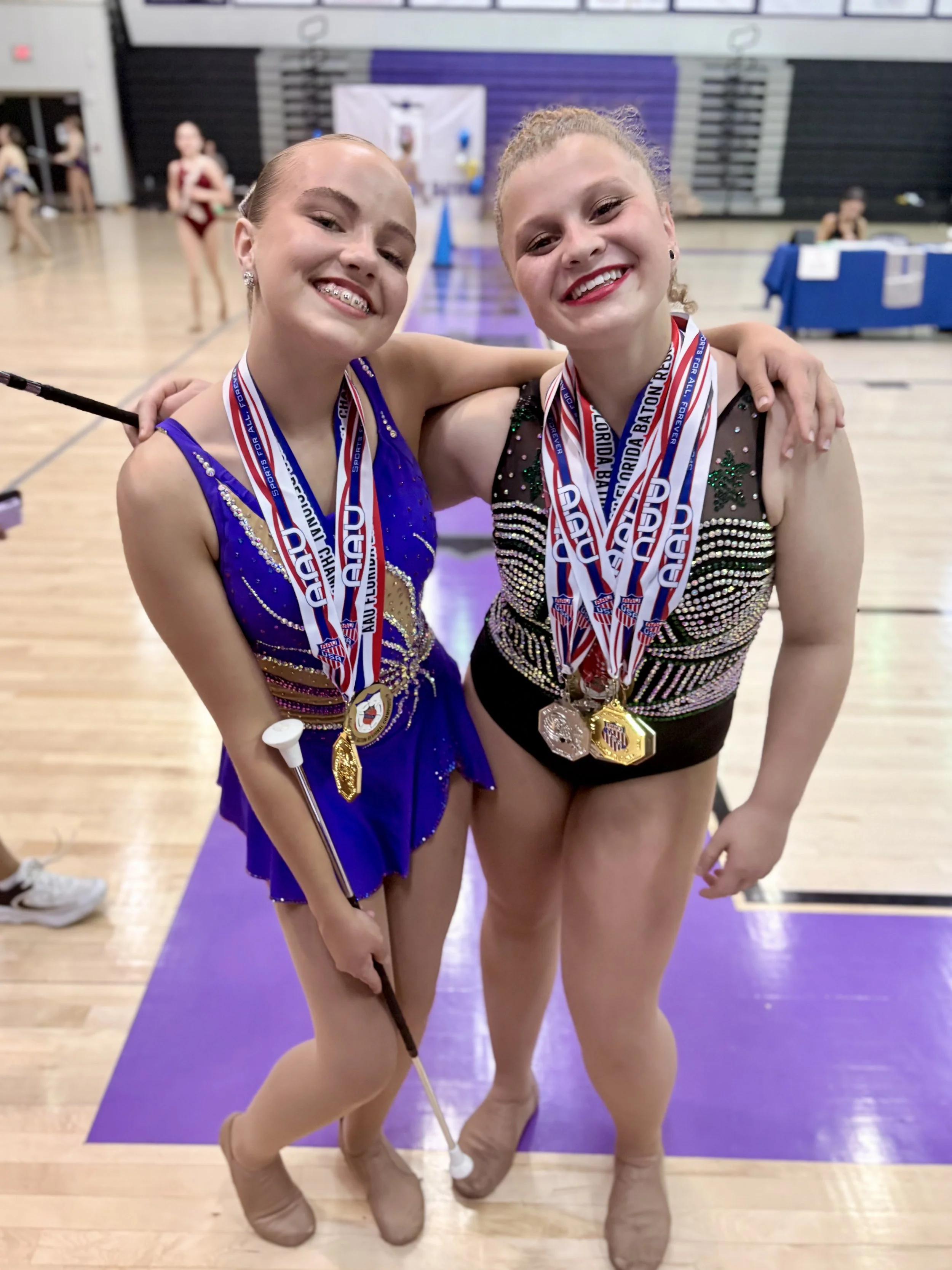 FLARE Baton Team Competitive Twirlers posing with their hard earned competition awards from the 2026 AAU Florida Baton & Dance Regional Championships!