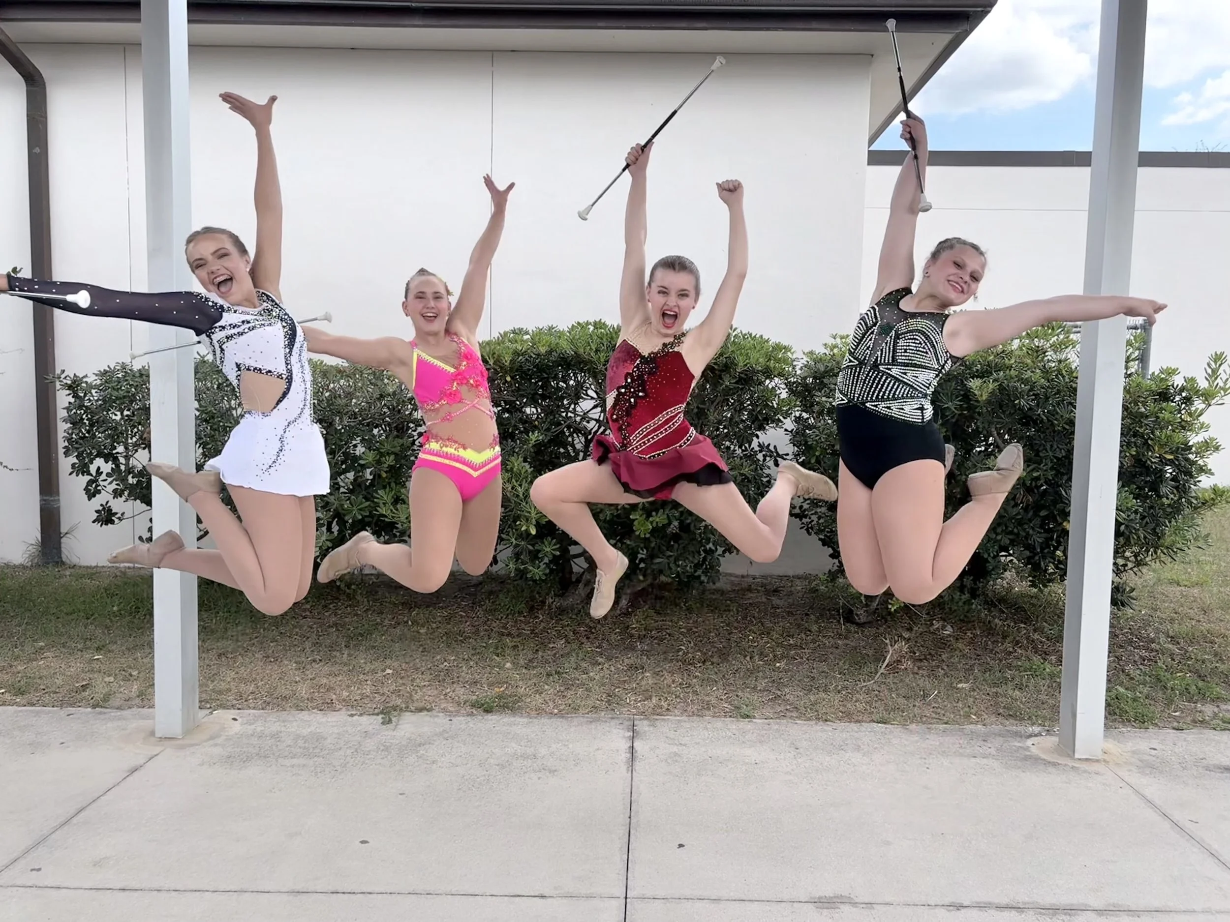 FLARE Baton Team Competitive Twirlers jumping for joy at the 2026 Miss Majorette of Florida Competition!