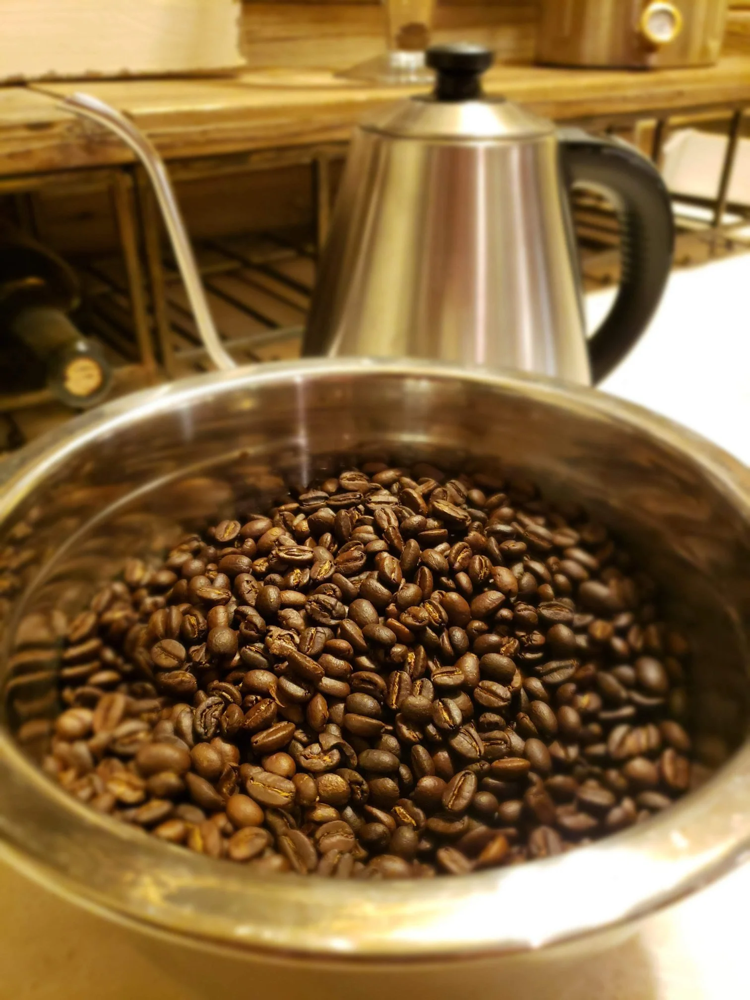 Bowl of coffee beans close up on the counter