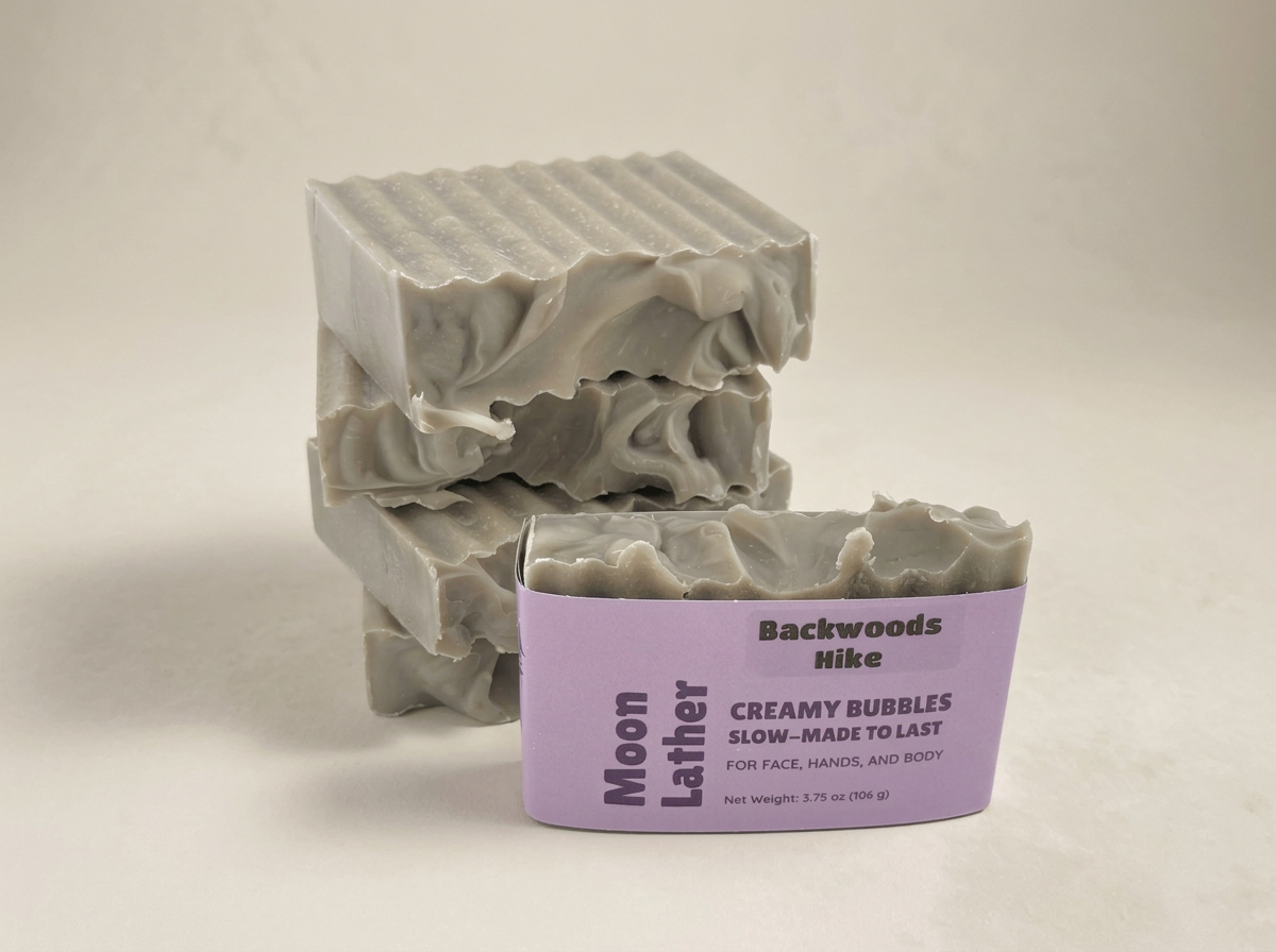 Gray Backwoods Hike Moon Lather soaps stacked behind one labeled bar