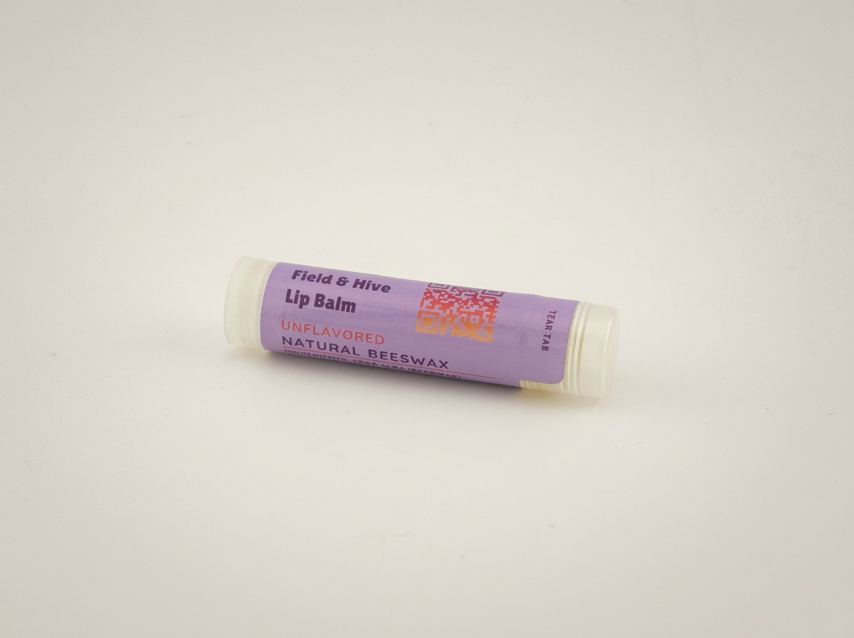 Field & Hive beeswax natural unflavored lip balm tube with a clear cap
