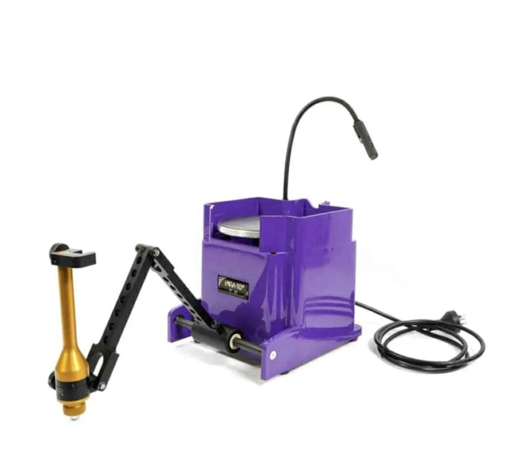 Purple laser engraving machine with a black flexible arm and a gold attachment.