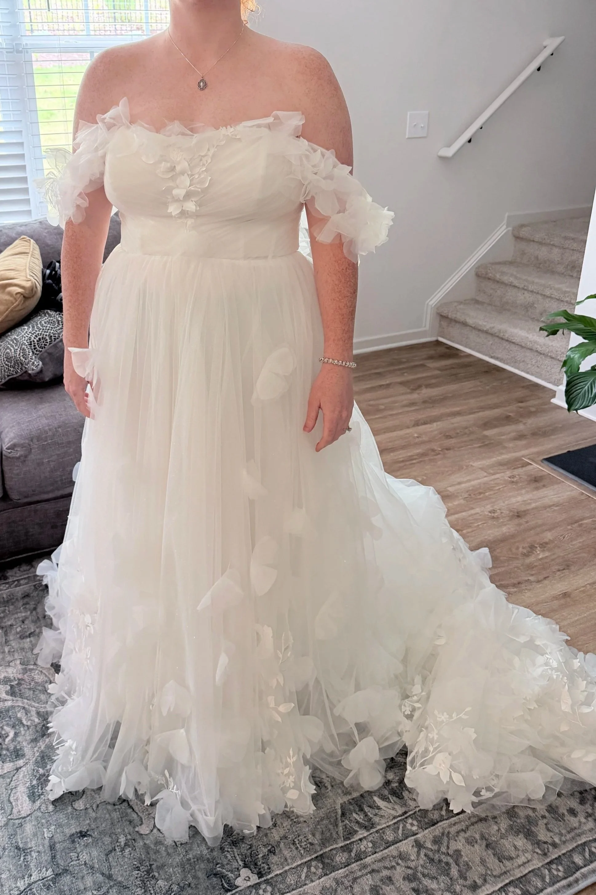 This is the finished result. A completely lined bodice with flowers added to the bust to add more modesty, a hem, and a bustle.