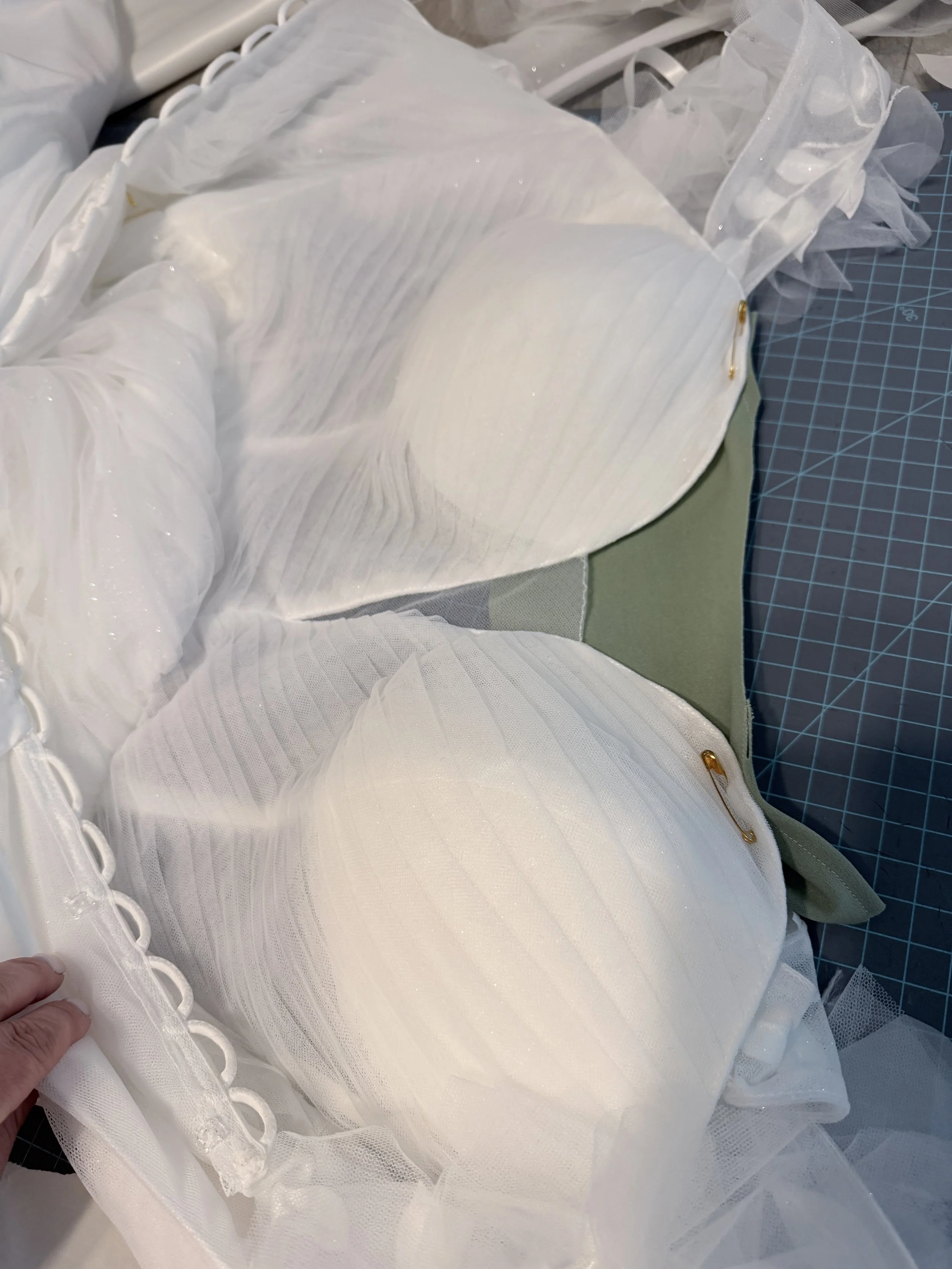 The client wanted the bodice of her gown to have a more modest neckline and to be lined.