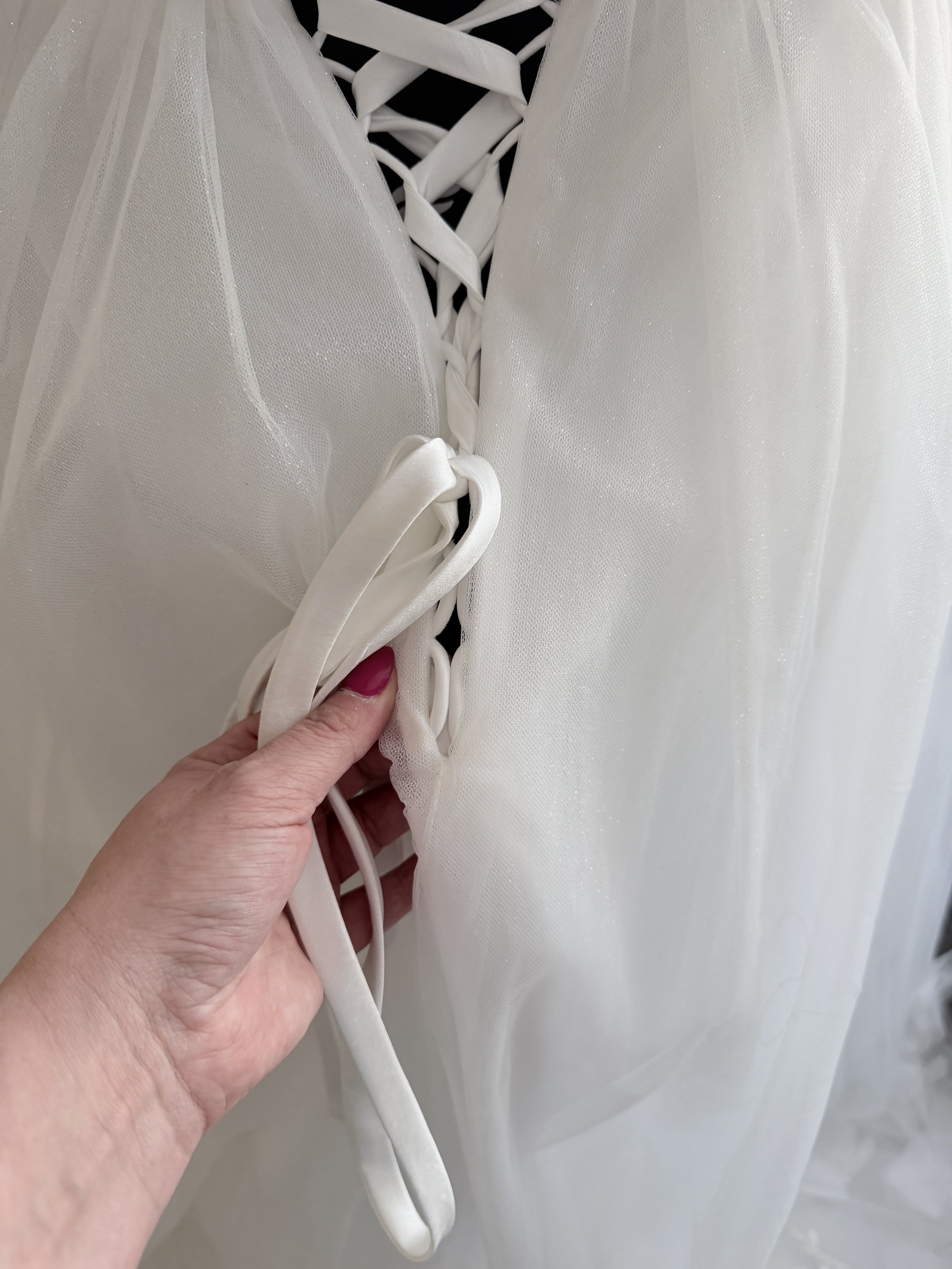 The lace up back was far too long. 