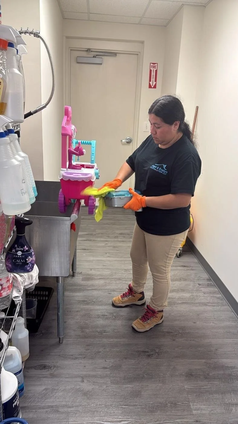 Crew member in a company shirt doing on-site contents cleaning of a toy