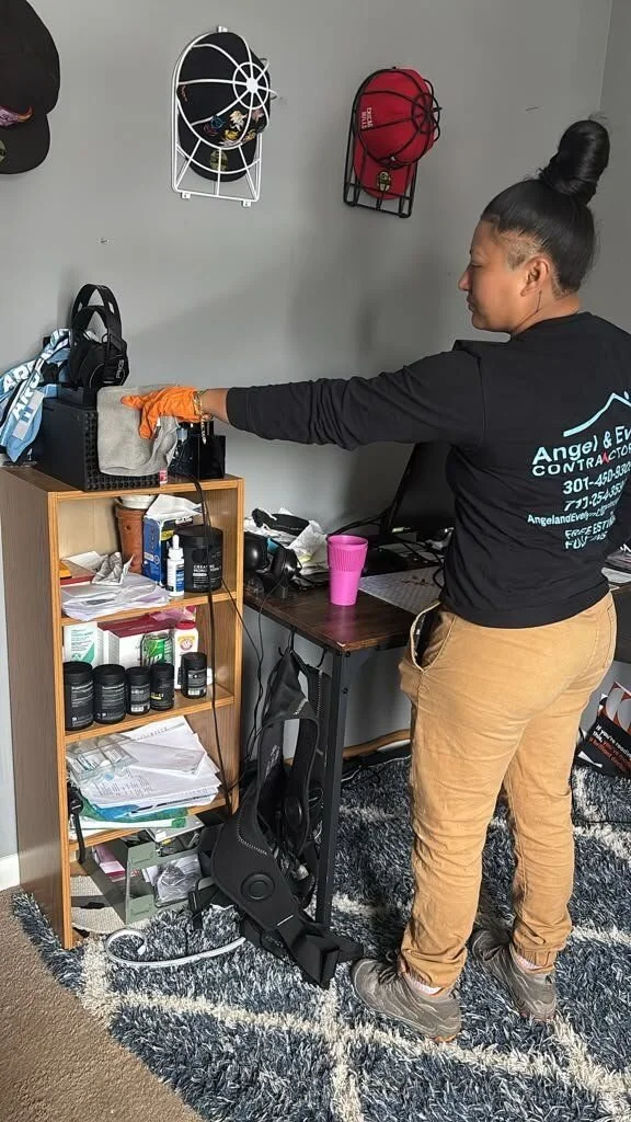 Angel & Evelyn Contractor crew member doing on-site contents cleaning of a shelf
