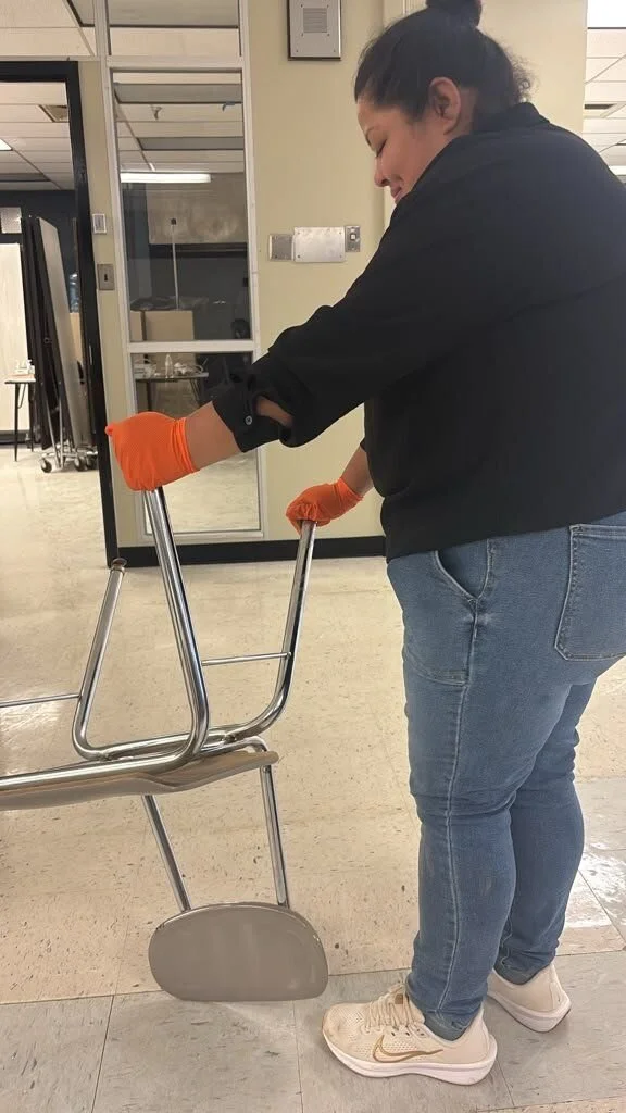 Crew member doing on-site contents cleaning of a chair