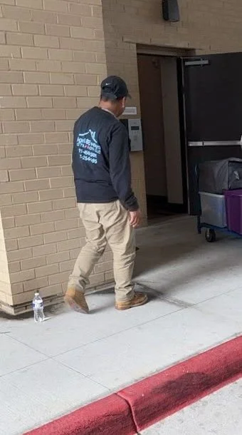 Crew member moving contents on a pack-out job