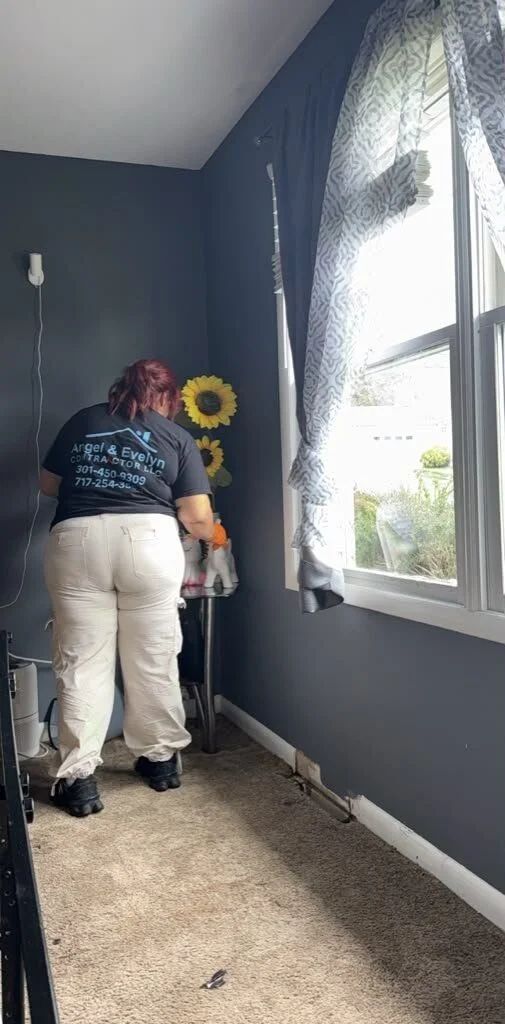 Angel & Evelyn Contractor crew member doing on-site contents cleaning in a bedroom