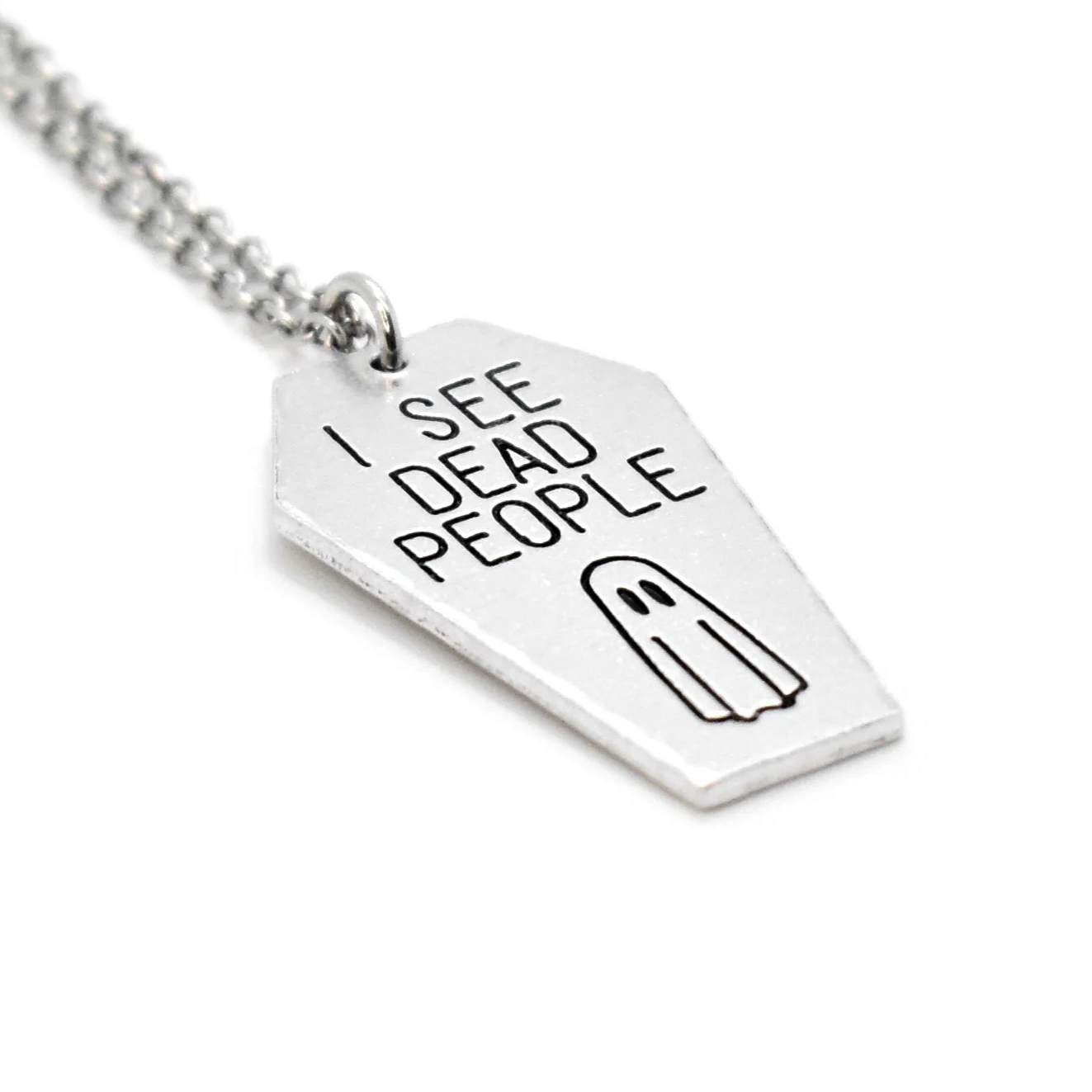 coffin pendant engraved with ghost and paranormal quote