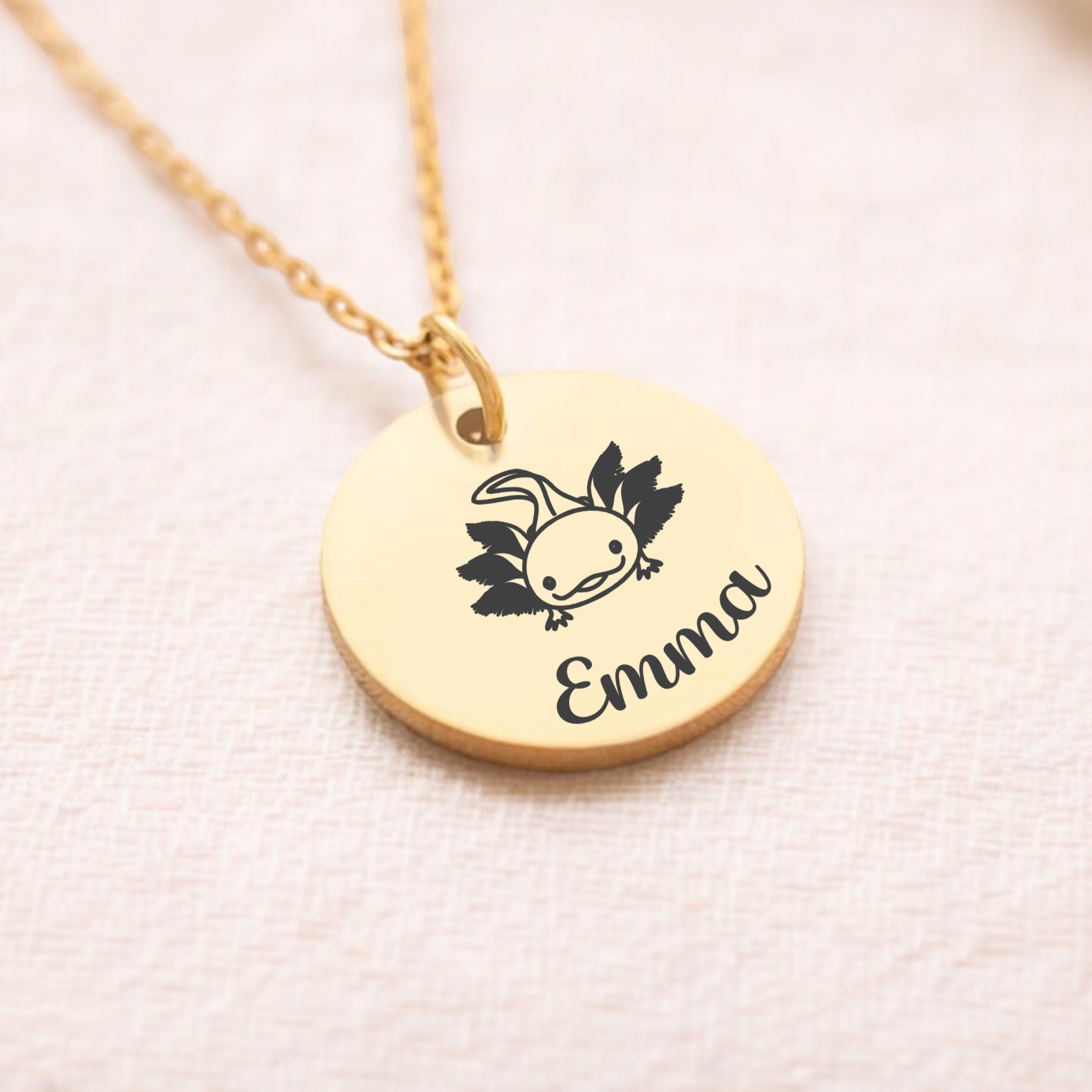 Custom Axolotl Necklace, complete with personalised name. The pendant is gold.