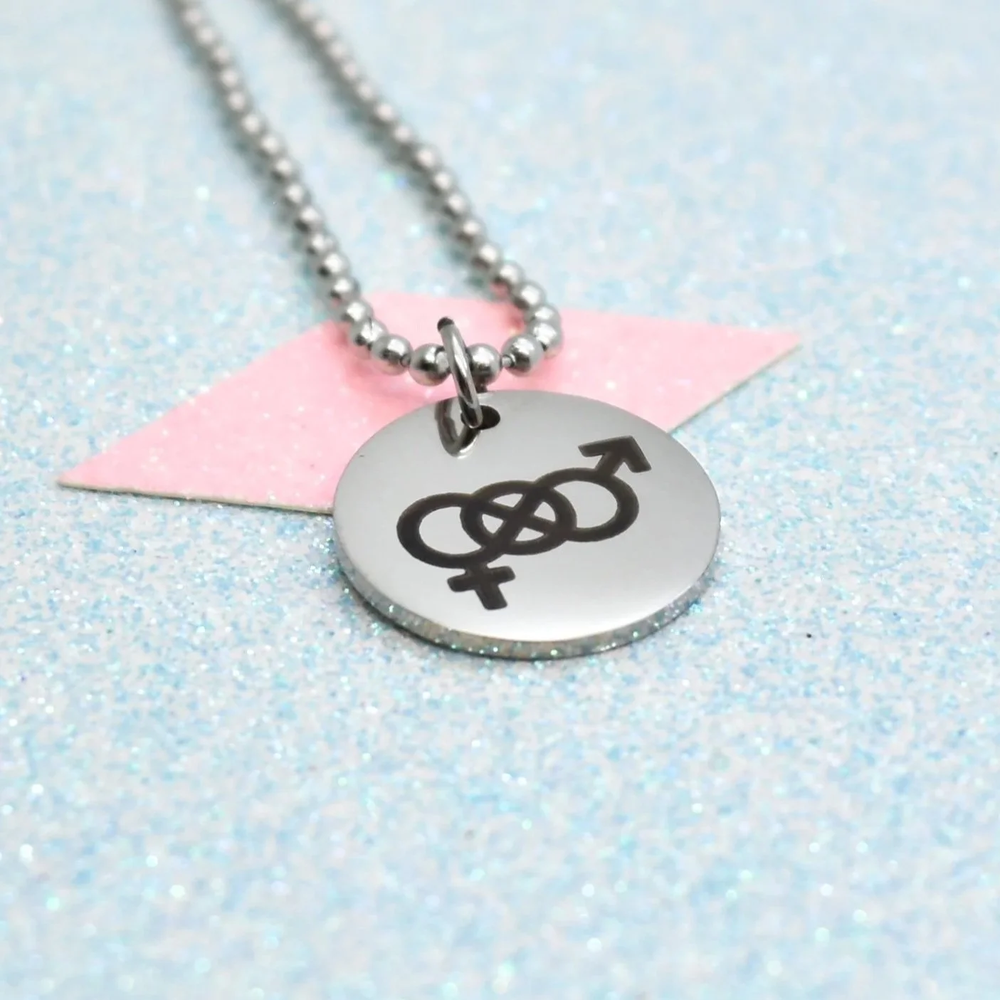 "Close-up of LGBTQ+ pride necklace with bisexual symbol pendant"
