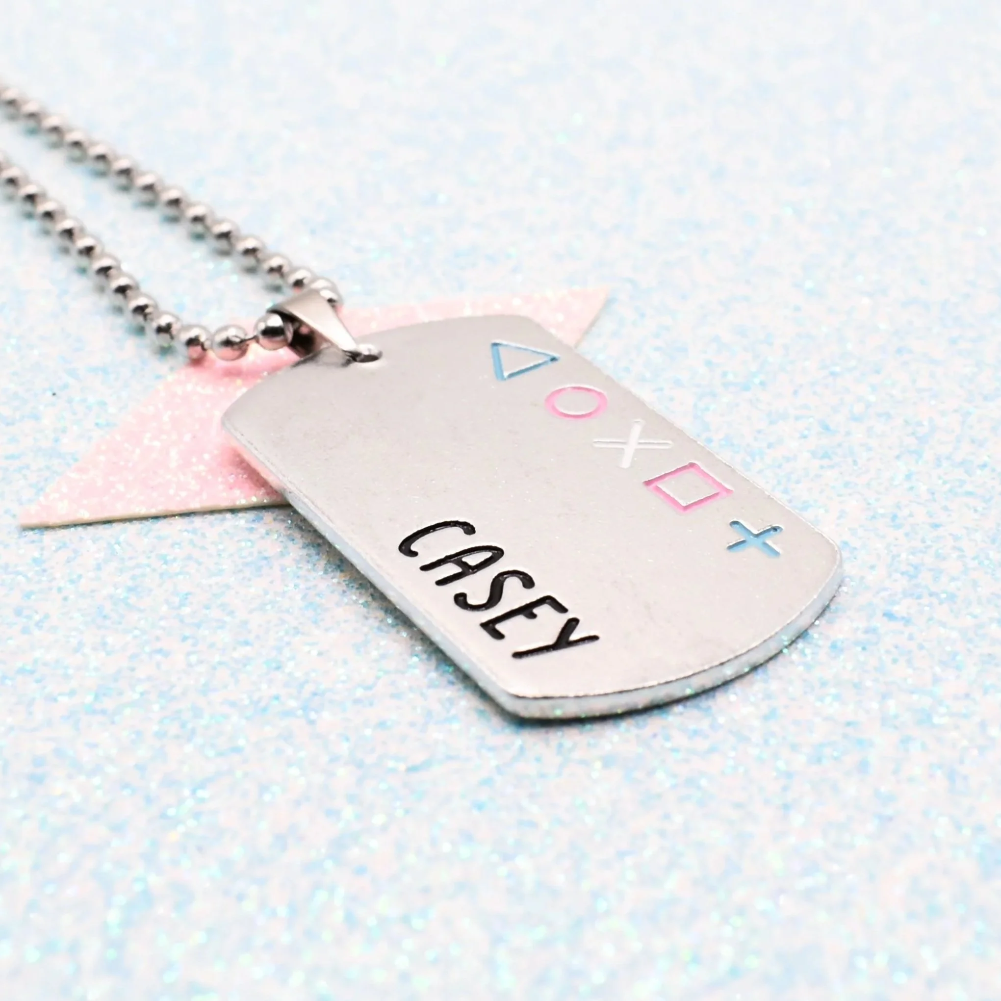 Personalised transgender pride jewellery with gamer symbols