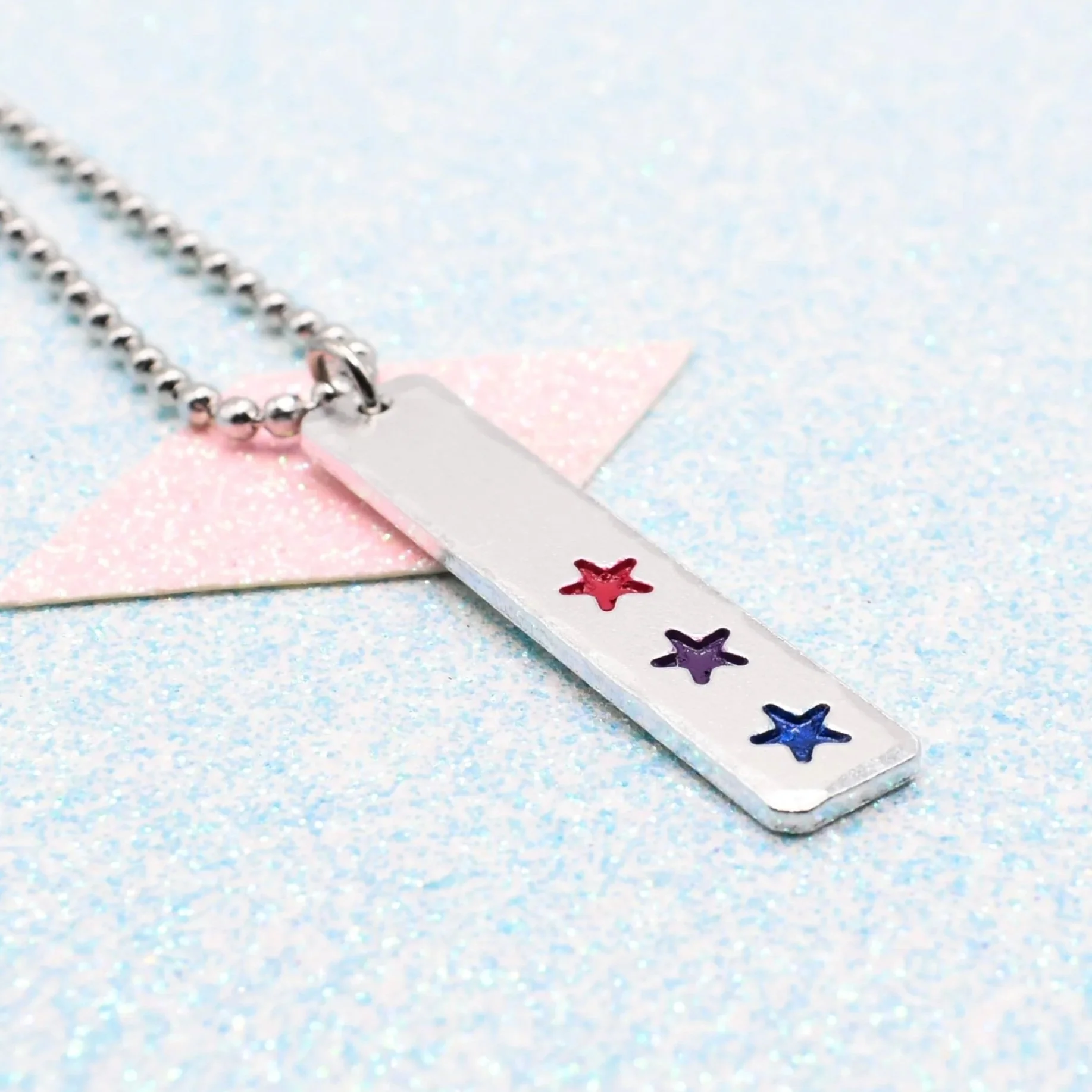 Hand stamped enamelled bisexual pride necklace with star pendant