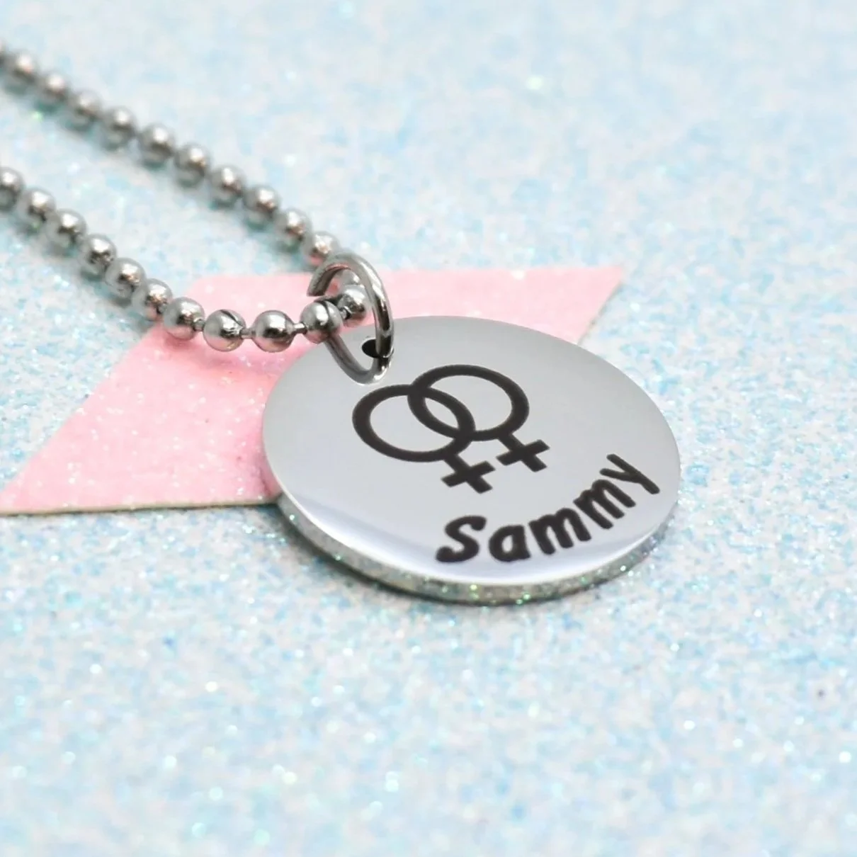 Engraved lesbian pride necklace with intertwined Venus symbol and personalised name