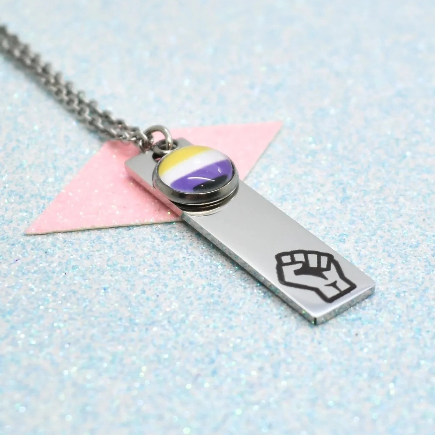 Raised fist pride jewellery for protest and solidarity