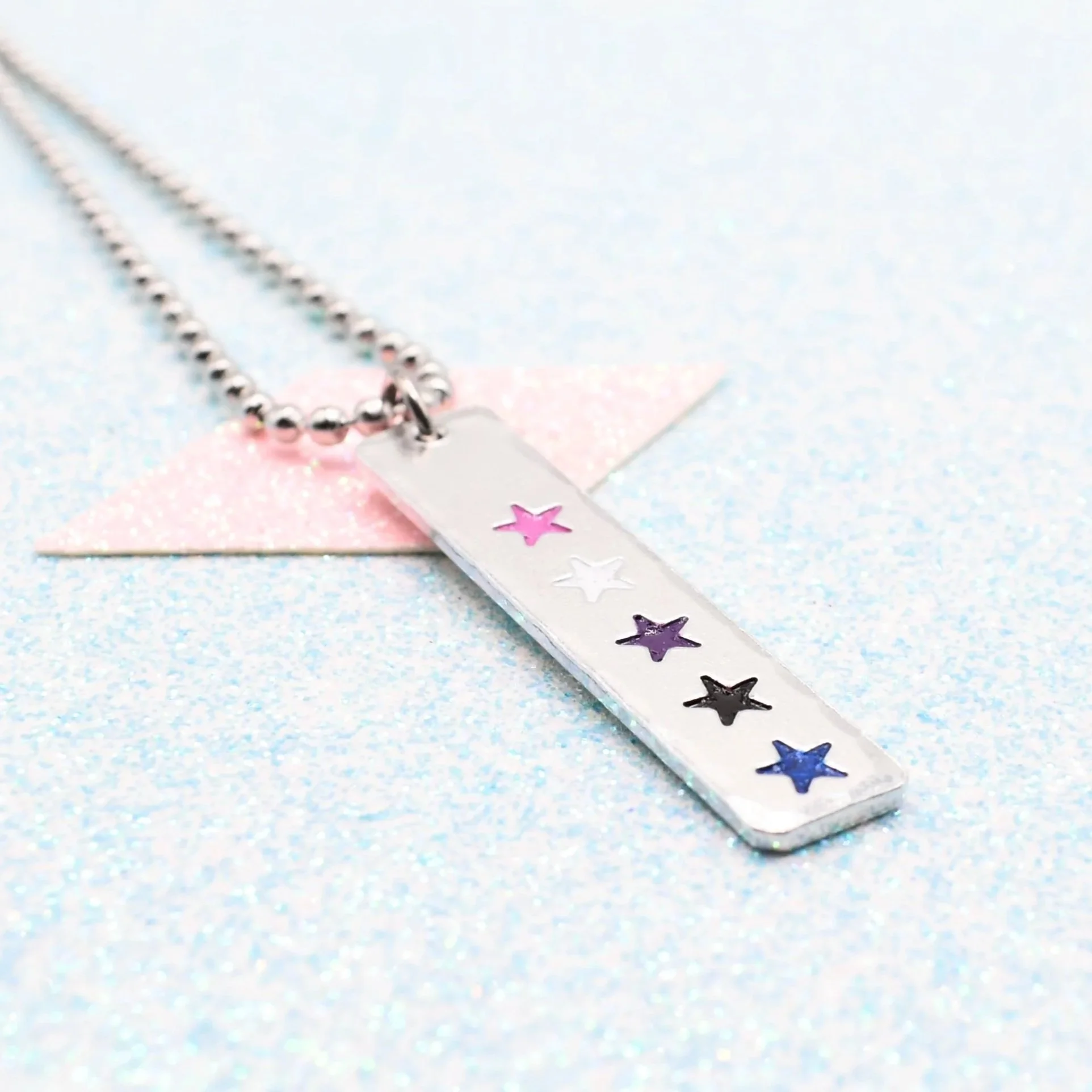 Hand stamped enamelled genderfluid pride necklace with star pendant